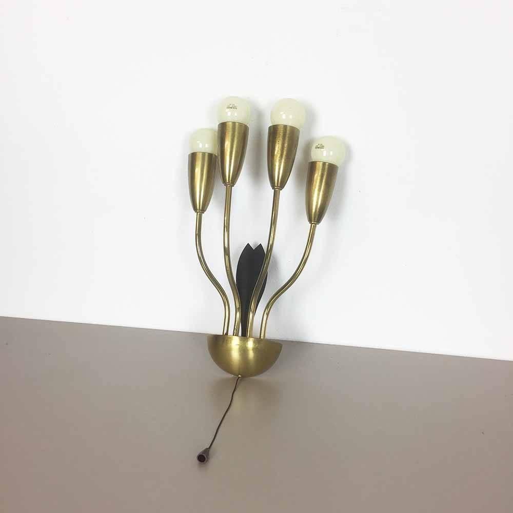 Article:

Brass wall sconces

Producer:

Origin Italy

Age:

1960s.


Description:

This modernist wall light was produced in Italy in the 1960s. It is made from solid metal and are brass plated. This light has four light sockets for