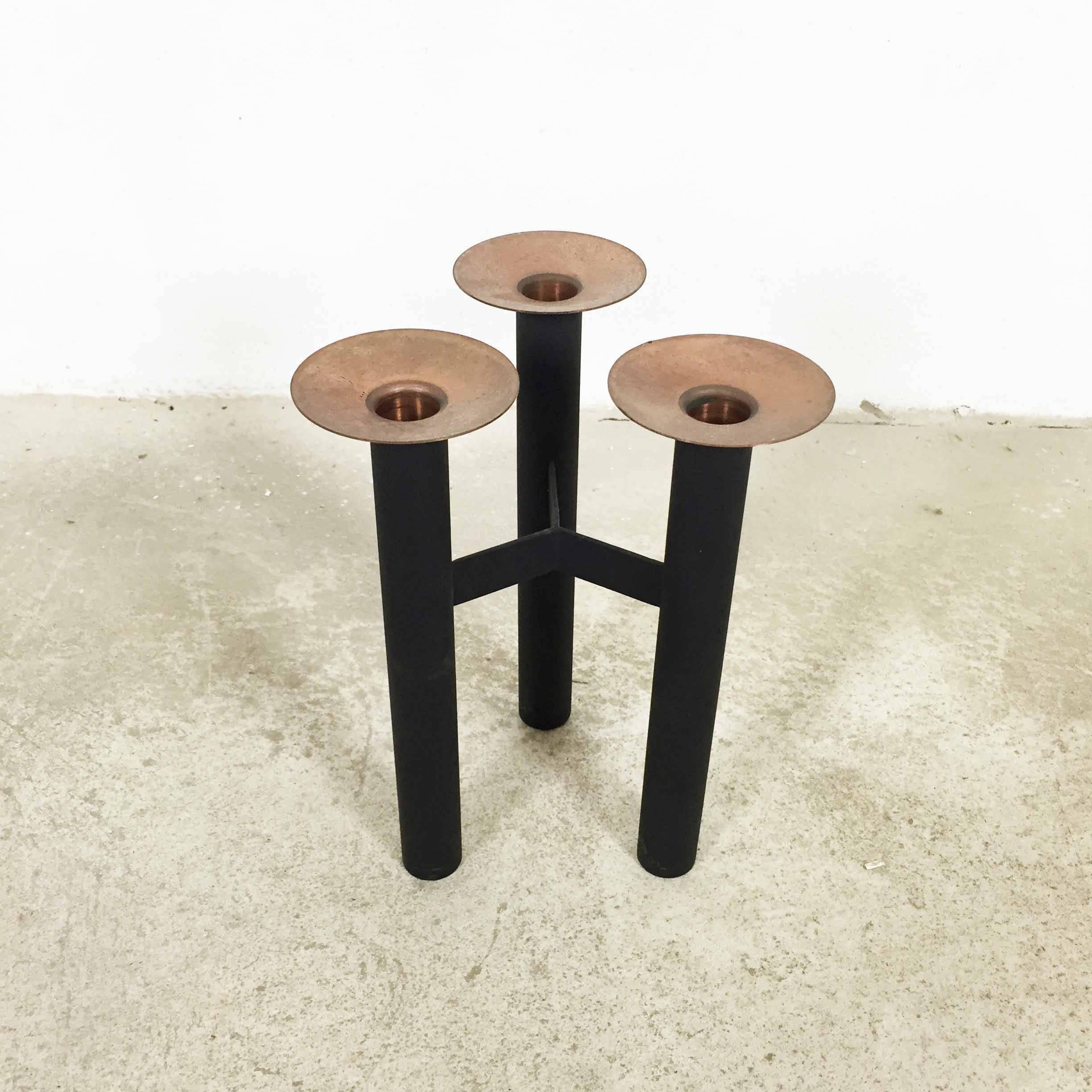 Modernist candleholder made in Denmark

Original 1960s candleholder made in Denmark. This candleholder element is made of solid metal and has a tripod base. The candle stick tops have a copper tone finish. This item remains in a good vintage