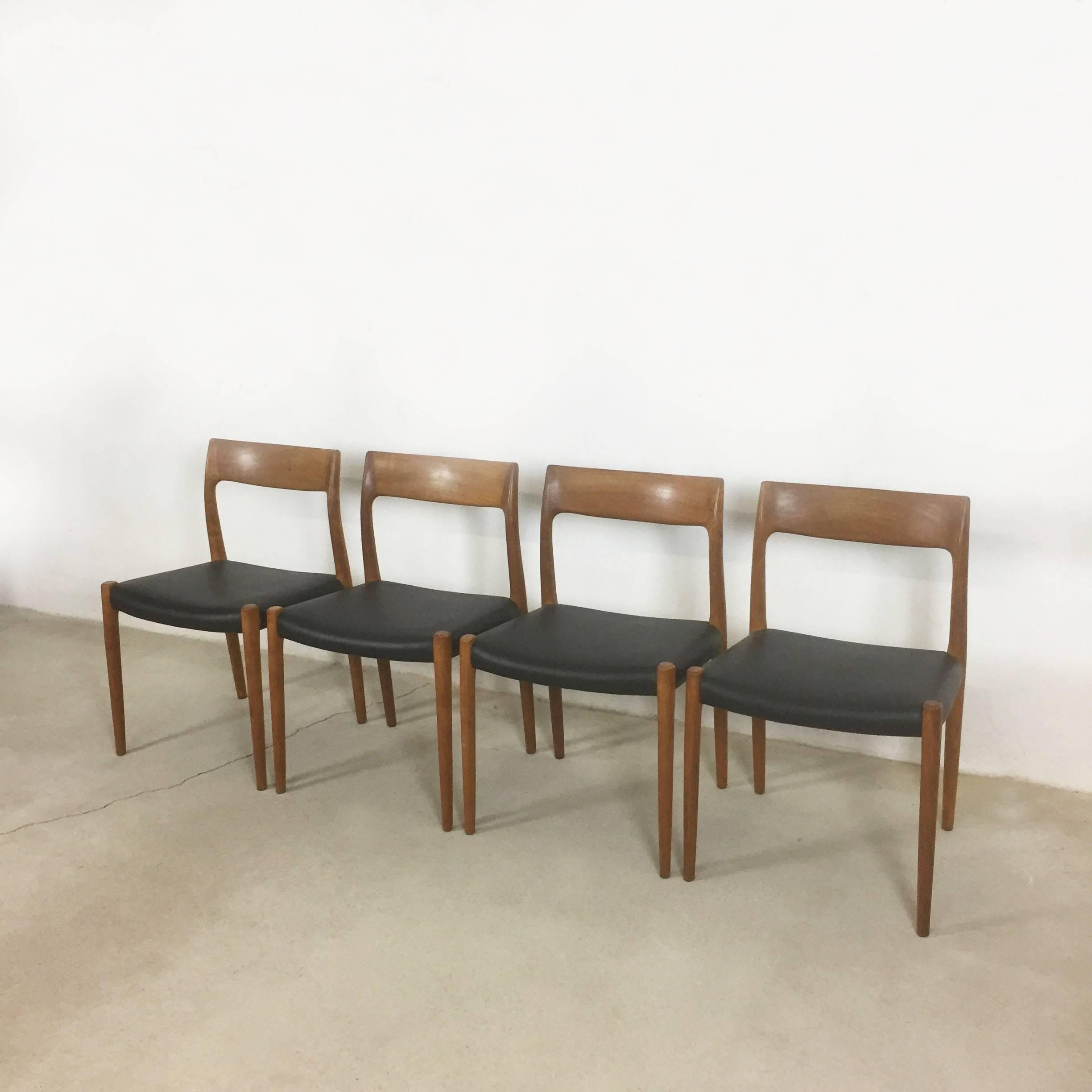 Set of four sophisticated dining chairs, designed by Nils Moller and manufactured in Denmark by Moller Models in the 1960s. The frames are made from solid teak wood and have leatherette seats. The frames are in a nice vintage condition with slight