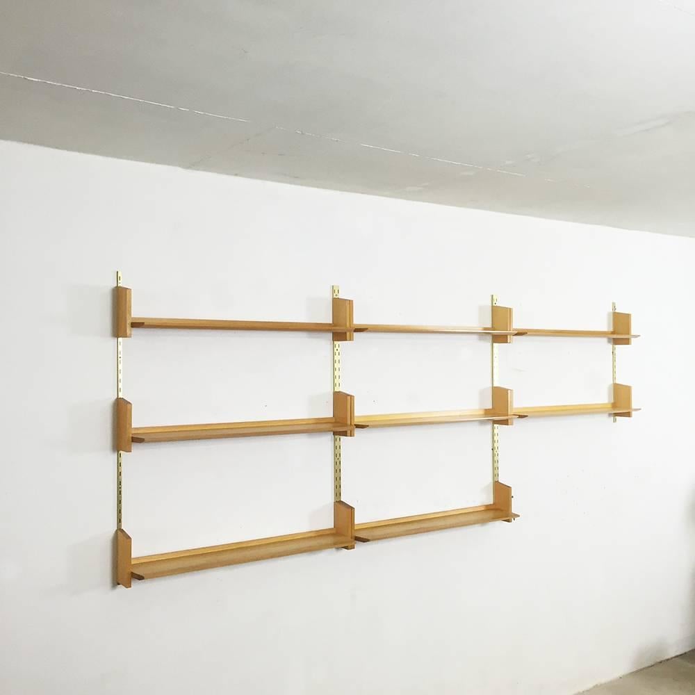 Modular wall unit

designed by Dieter Reinhold 

produced by WK Möbel, Germany

1950s

light elmwood board and brass wall holder.

This Mid-Century shelving system was designed by Dieter Reinhold in the 1950s and was manufactured by WK