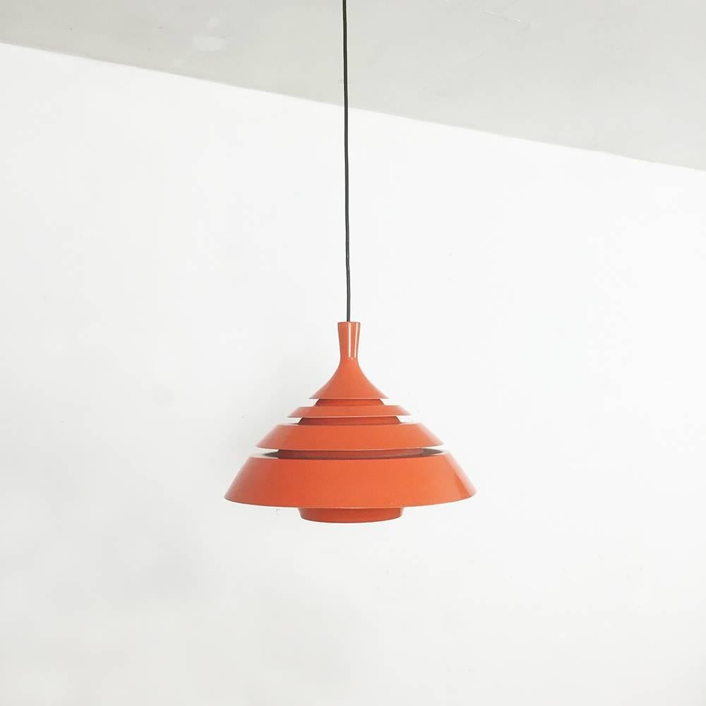 Orange pendant light,

Reminiscent of the design and work of Hans Agne Jakobsson, Sweden,

1960s.

This hanging lamp was designed and produced in the 1960s in Sweden. The design is reminiscent of the swedish desigern Hans-Agne Jakobbsson.
The