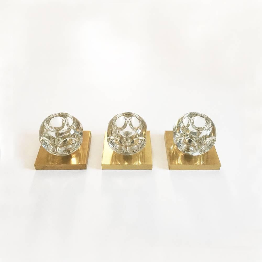 Set of three 1970s wall lights ice cubes made of glass in ice cube form and wall plate in brass producer: Peill & Putzler, Germany et of three original 1970s modernist wall lights in ice cube form with wall fixation in bras. Made by Peill & Putzler