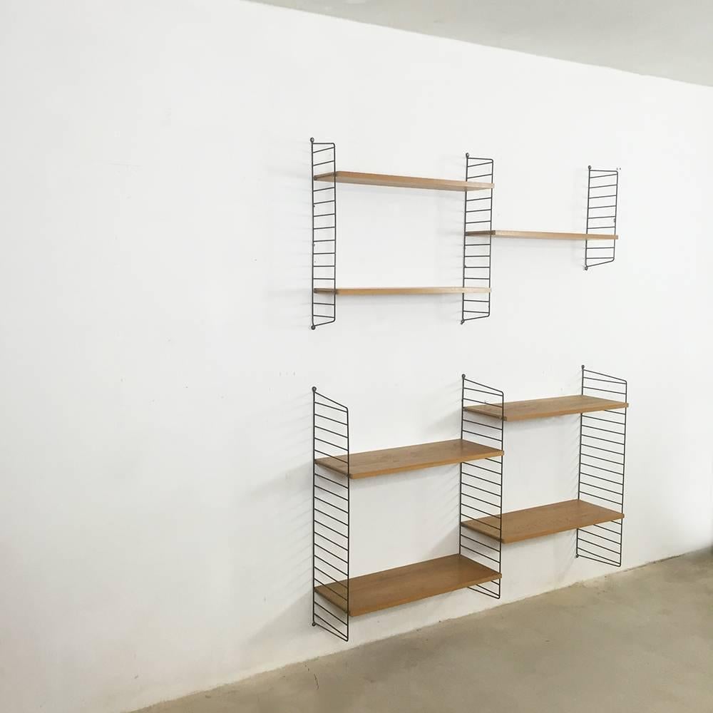 String Regal wall unit

Made in Sweden

Bokhyllan ’The Ladder Shelf’

Design: Nils und Kajsa Strinning, 1949

The architect Nisse Strinning was born in 1917. From 1940 to 1947 he studied architecture in Stockholm, before he designed the