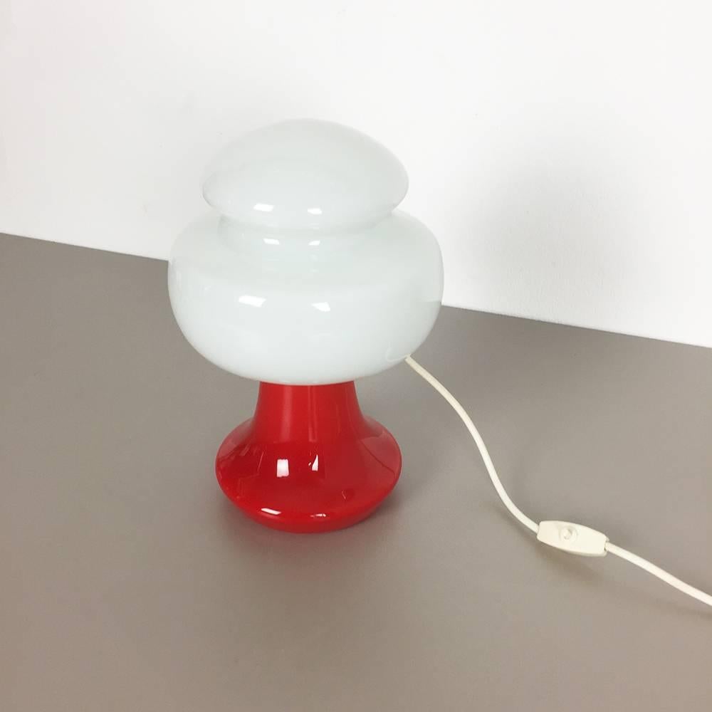 Article:

Table light


Origin:

Sweden


Material:

Handblown glass in red and white


Age:

1970s




Description:

Rare table light produced in the 1970s in Sweden. this light is made of high quality handblown glass, in