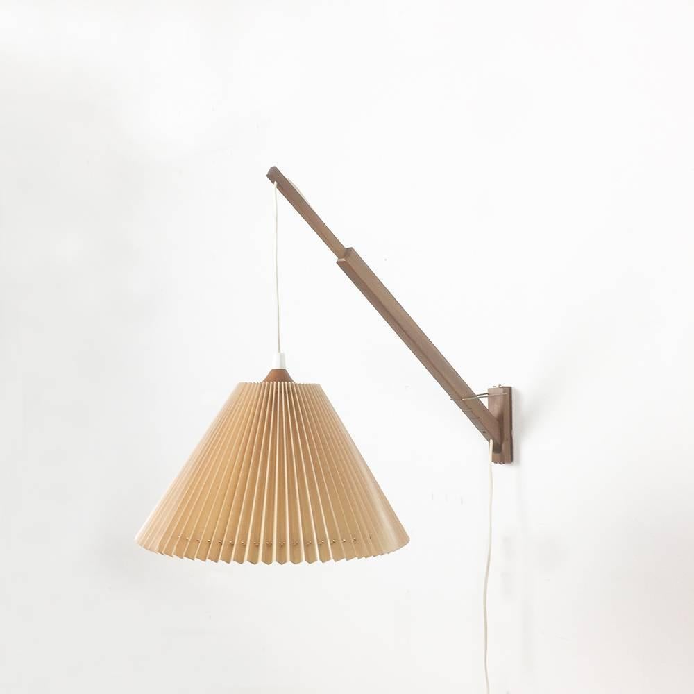 Article:

wall light 


Origin:

Denmark


Decade:

1960s




Description:

This wall light was designed and produced in Denmark in the 1960s. The extendable wall fixation of this light is made of walnut wood and the shade is made
