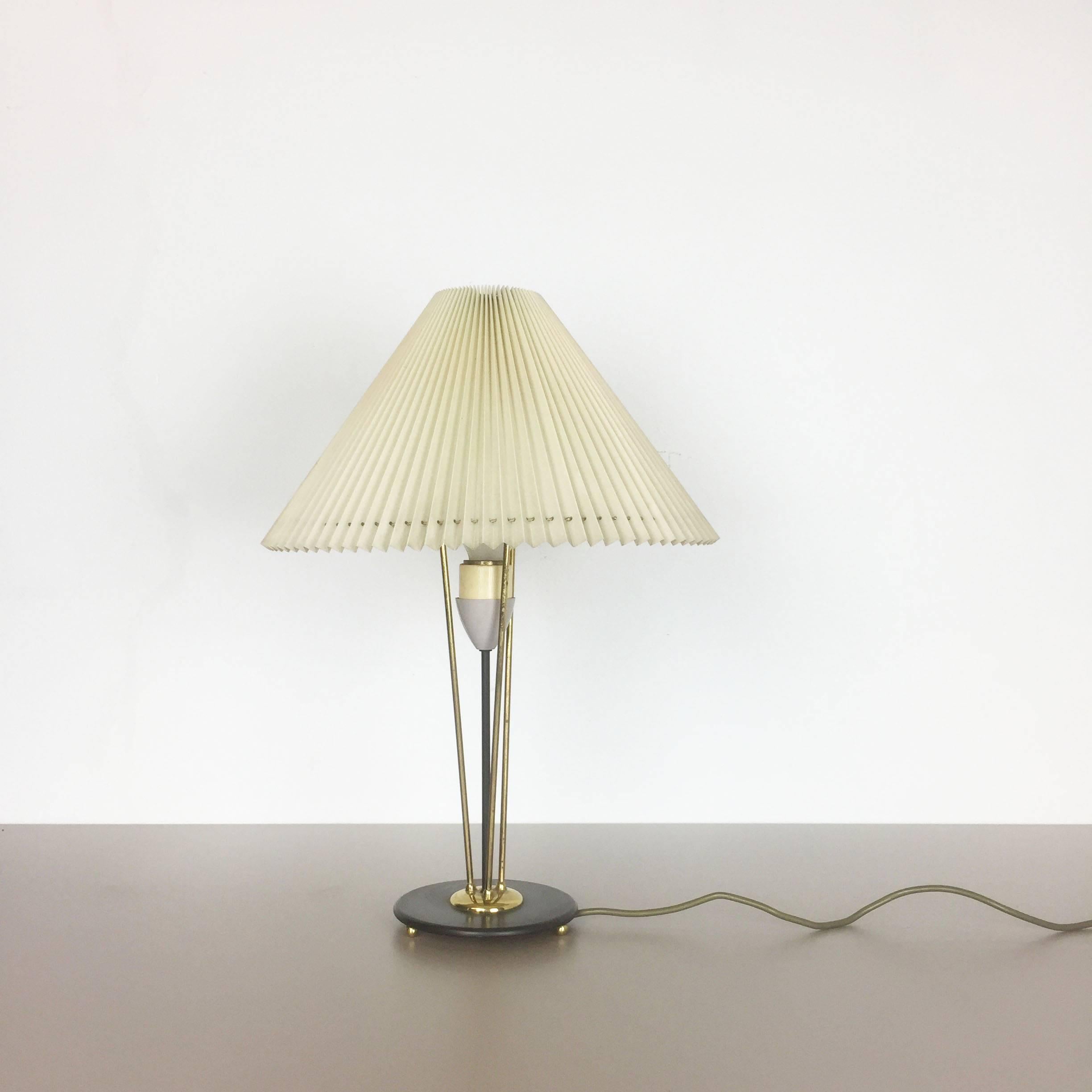 Article:

Table light


Origin:

Italy


Age:

1950s



Description:

Original 1960s table light made in Italy. This wonderful modernist 1960s table light comes with a huge original plissé pleating plastic shade. The black base is