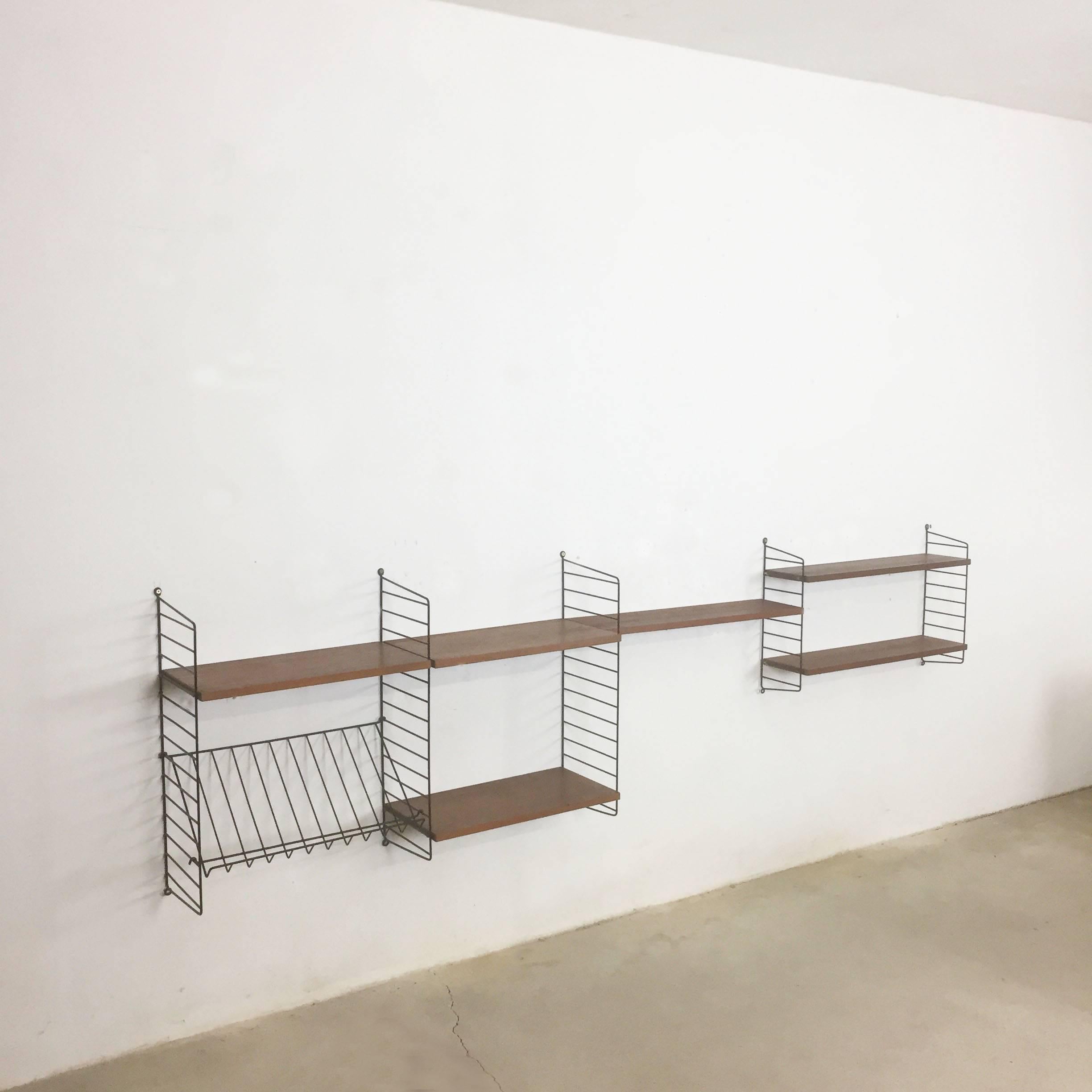 String Regal wall unit

Made in Sweden

Bokhyllan 'The Ladder Shelf’

Design: Nils und Kajsa Strinning, 1949

The architect Nisse Strinning was born in 1917. From 1940 to 1947 he studied architecture in Stockholm, before he designed the