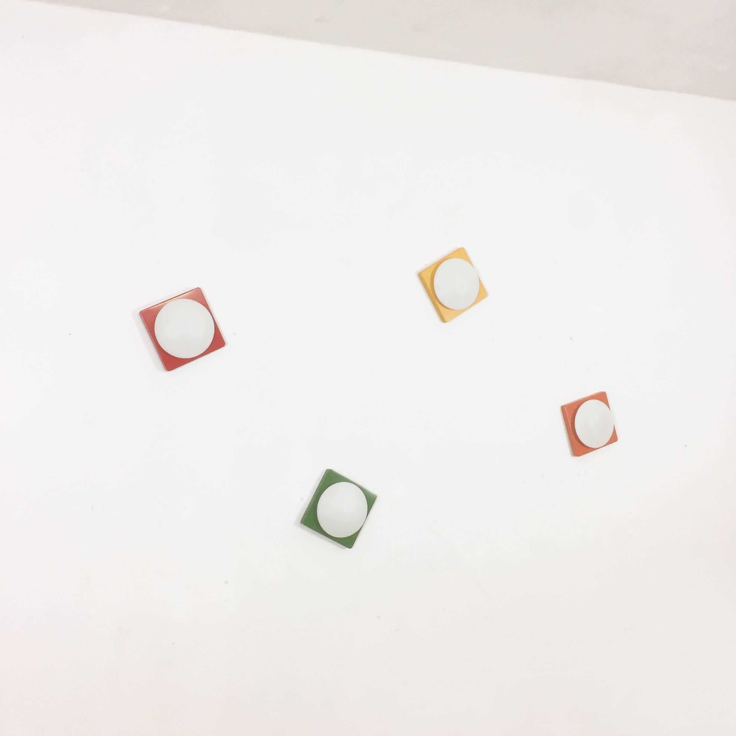 Article:

set of four cubic wall lights red, orange, green, yellow


Age:

1970s


Description:

Set of four original 1970s German modernist wall Lights made of solid metal with a frosted glass shade in the middle. this light was