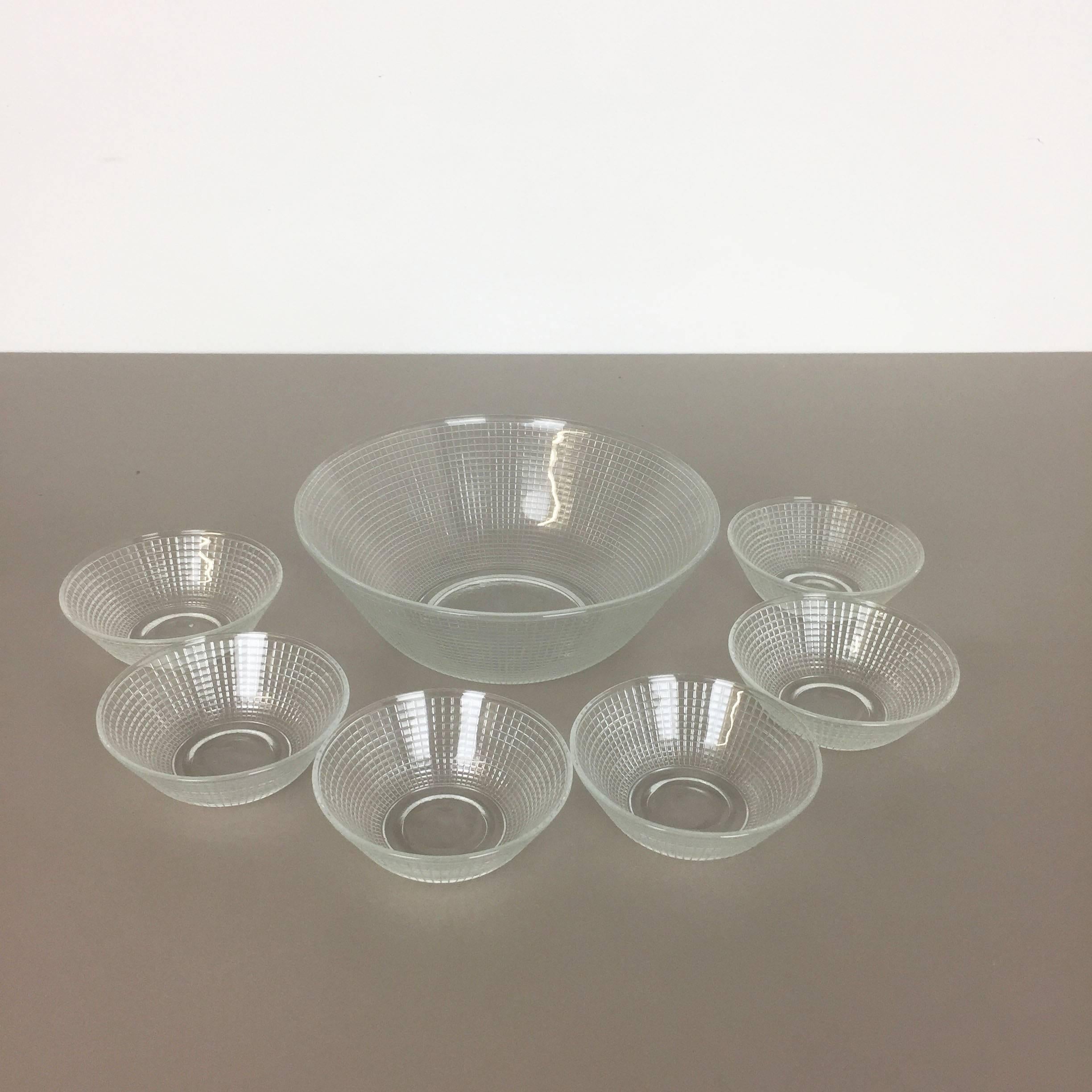 Article:

Set of seven glass shells


Producer:

WMF, Germany


Design:

Prof. Wilhelm Wagenfeld Bauhaus 



Decade:

1950s-1960s


Description:

Original vintage 1960s set of 27 glass shell of the "Greifswald Series" designed by designed