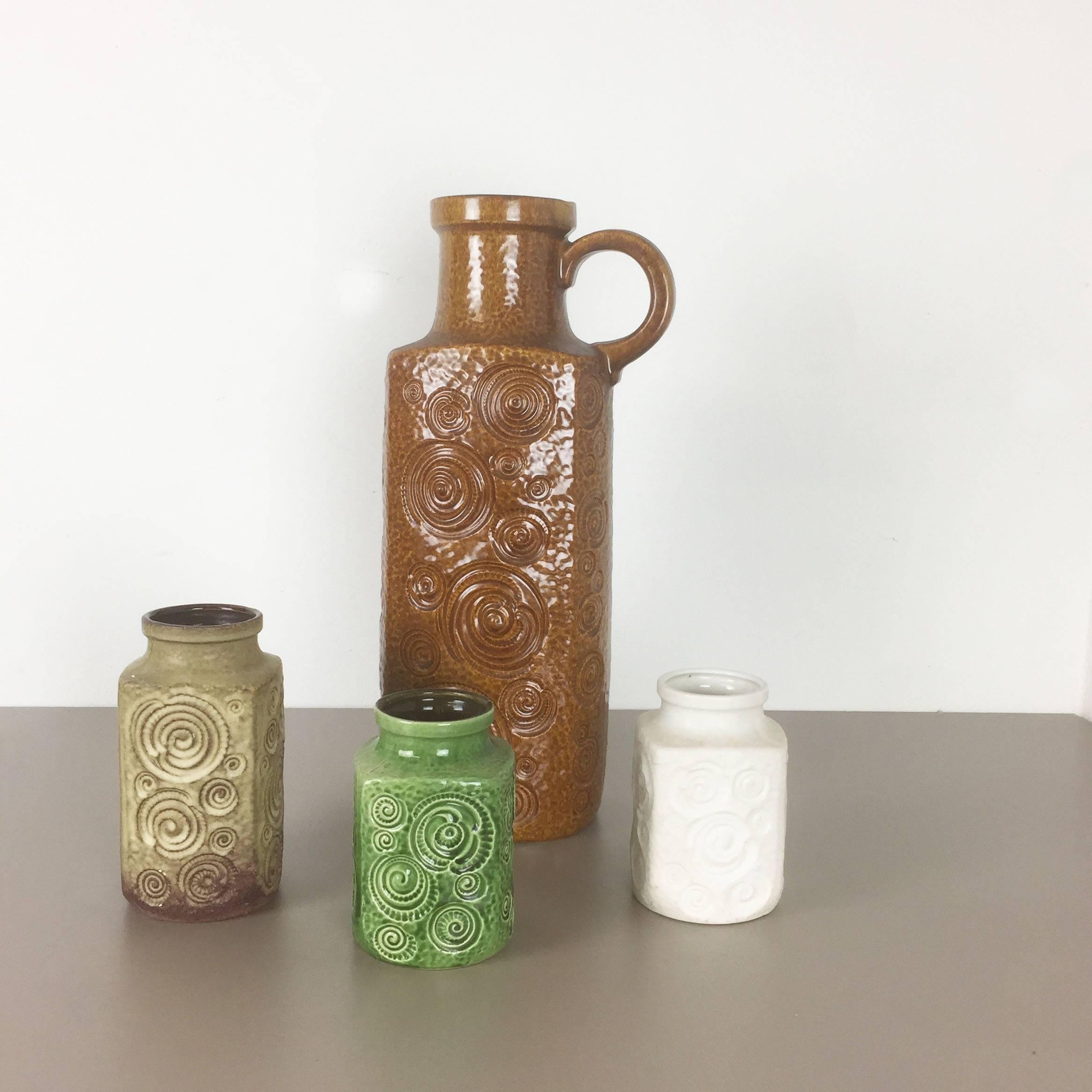 Article:

Set of four fat lava art vases

Model: onion

Producer:

Scheurich, Germany



Decade:

1970s


Description:

These original vintage vases was produced in the 1970s in Germany. it is made of ceramic pottery in fat lava