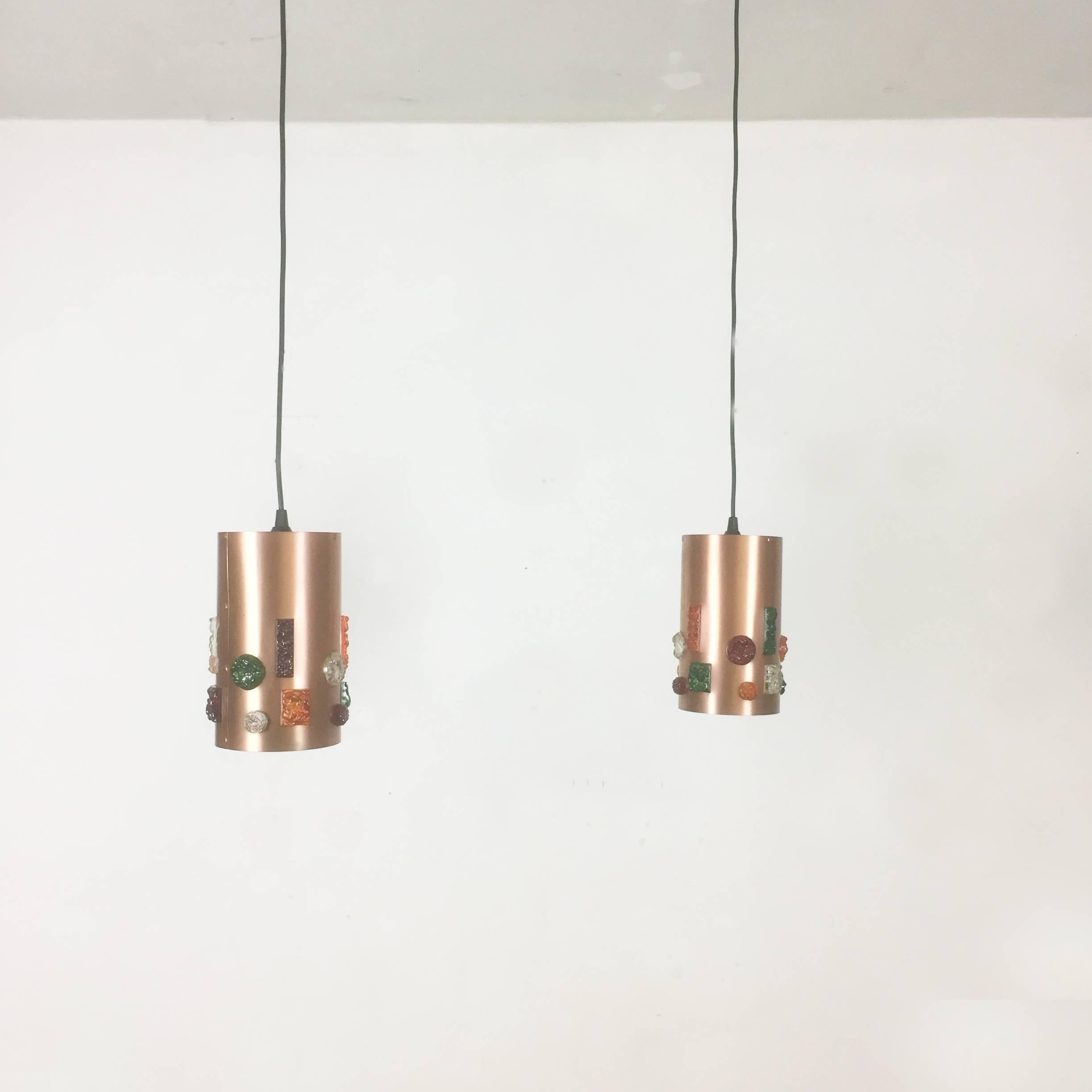 Article: hanging light set of two



Origin: Germany


Age: 1970s 


Description: 

This fantastic set of two hanging lights was designed and produced in 1970s in Germany. the two shades are made of thin copper and do have several