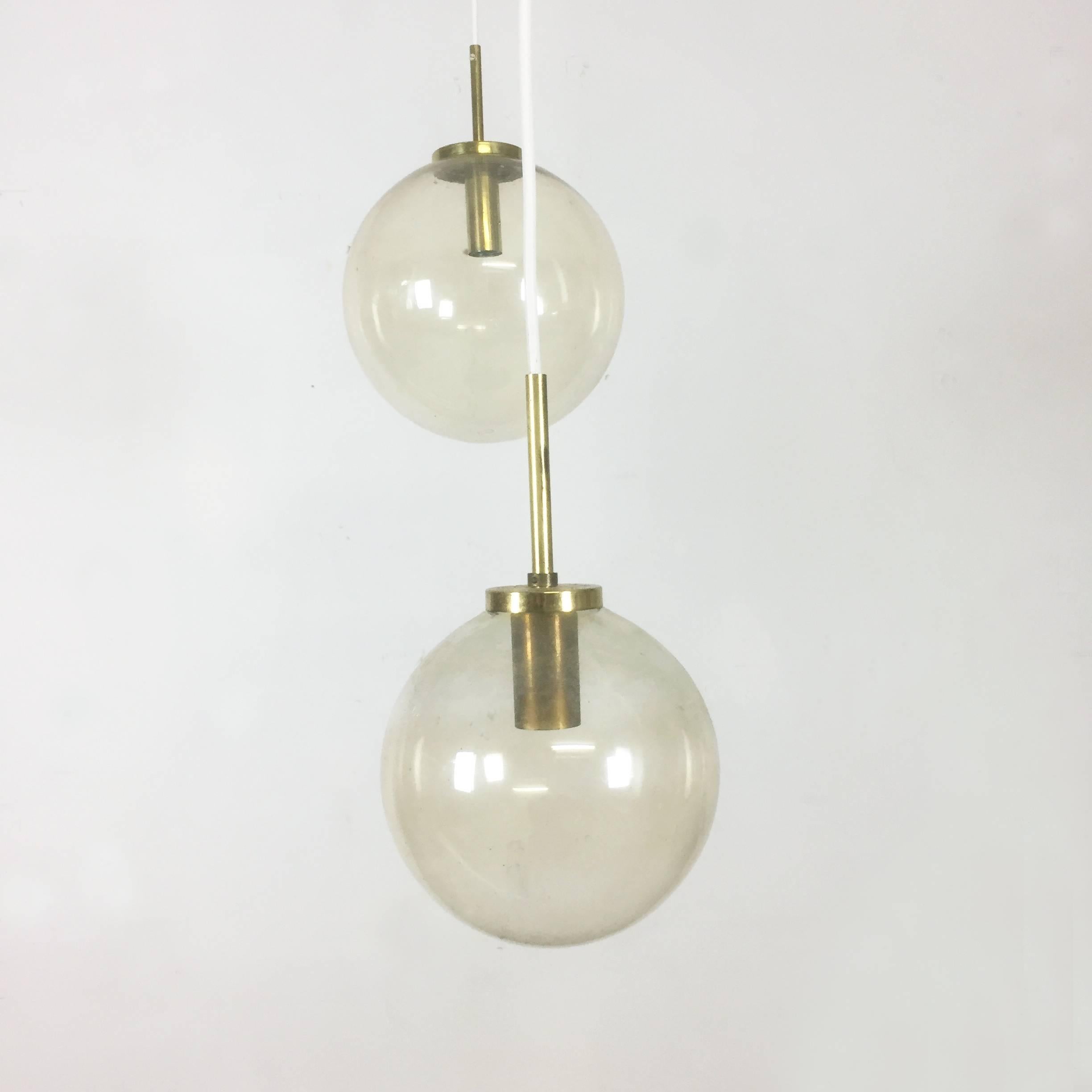 Article: Hanging light set of three


Producer: Glashütte Limburg


Origin: Germany


Age: 1960s 


Description: 

This fantastic set of three ball hanging lights was designed and produced in 1960s in Germany by Glashütte Limburg. The