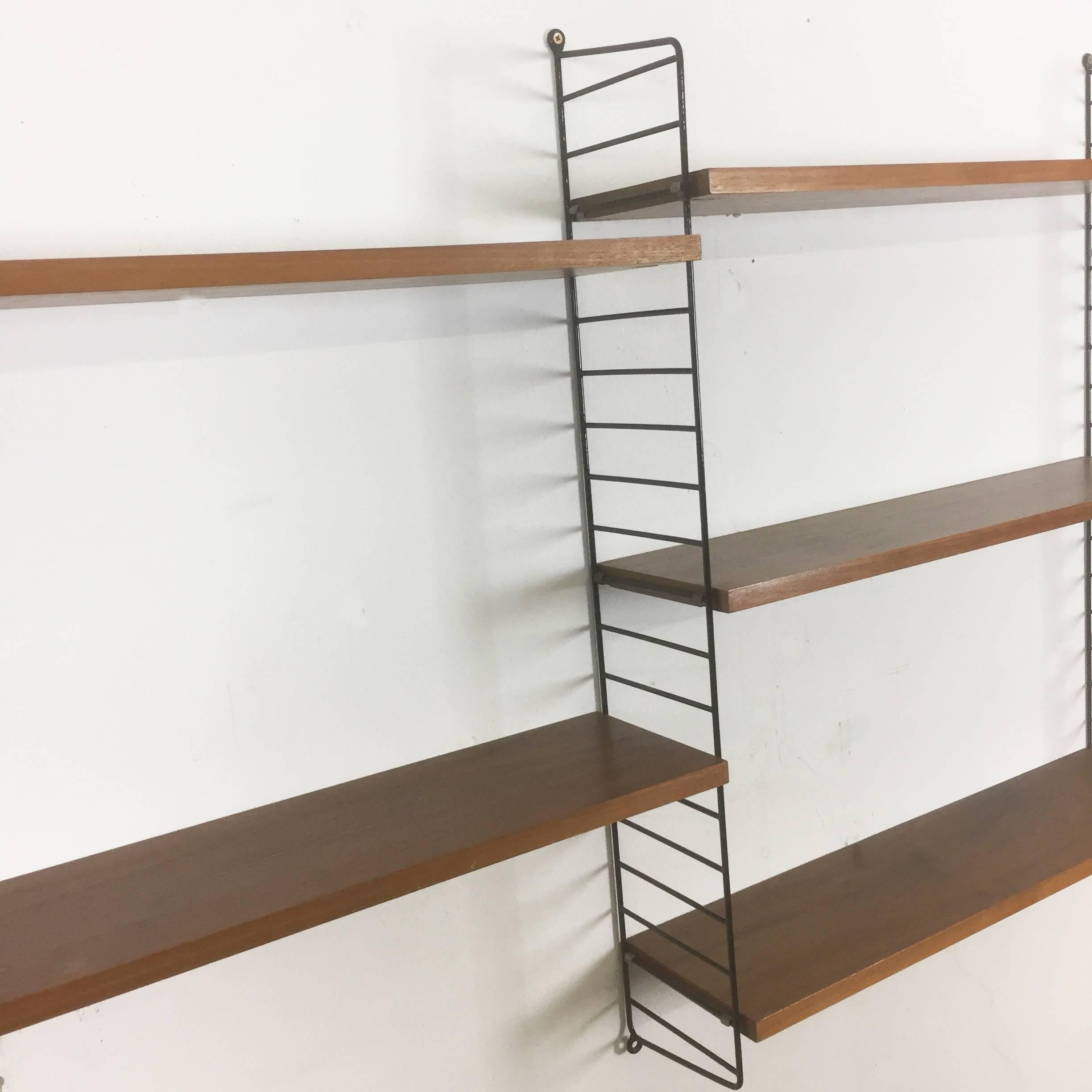 String Regal wall unit

Made in Sweden

Bokhyllan ’The Ladder Shelf’

Design: Nils und Kajsa Strinning, 1949

The architect Nisse Strinning was born in 1917. From 1940-1947 he studied architecture in Stockholm, before he designed the
