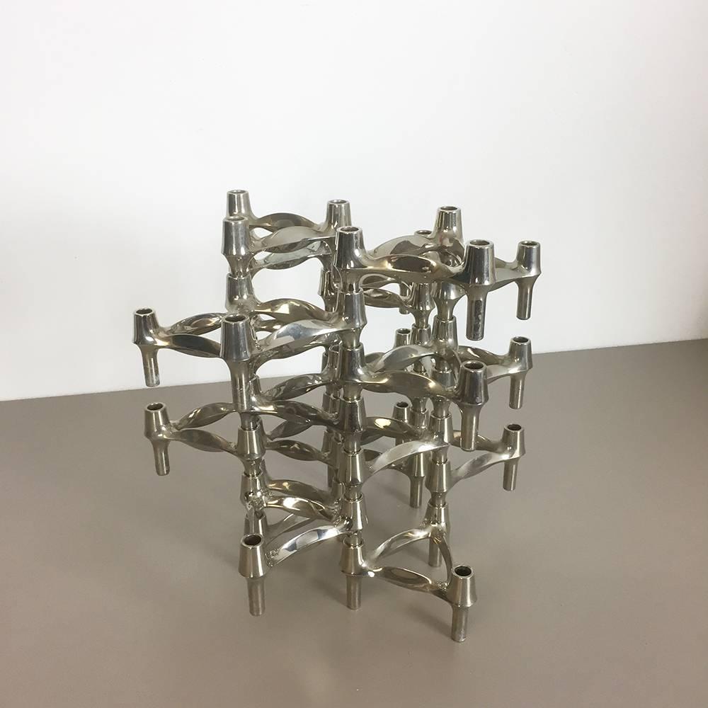 Article:

20 metal candleholder elements


Producer:

BMF Nagel, Germany


Design:

Caesar Stoffi


This original vintage set of 20 metal candle holders, was produced in the 1970s in Germany by BMF Nagel. Due to the three stacking option of each