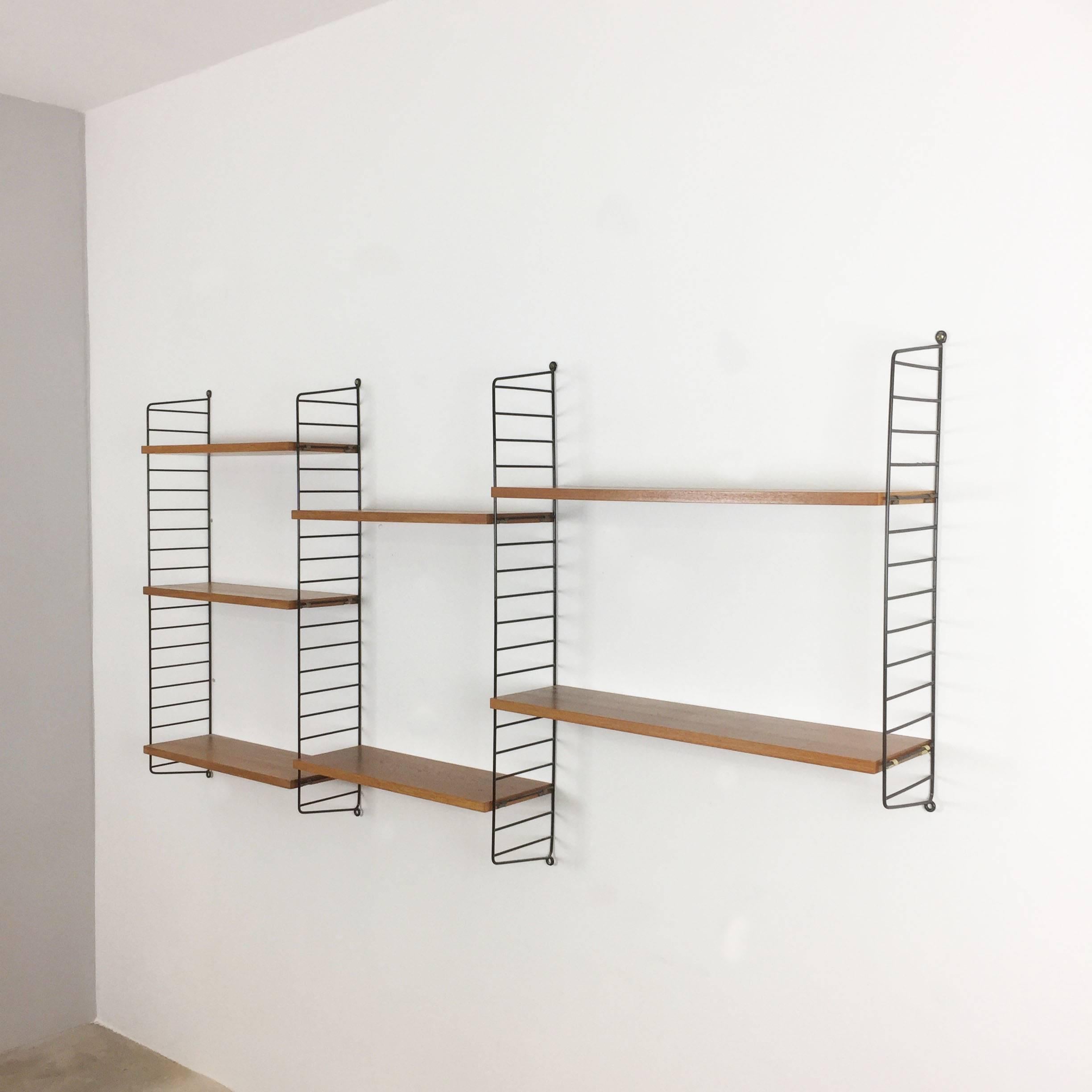 String Regal wall unit

Made in Sweden

Bokhyllan ’The Ladder Shelf’

Design: Nils und Kajsa Strinning, 1949

The architect Nisse Strinning was born in 1917. From 1940 to 1947 he studied architecture in Stockholm, before he designed the