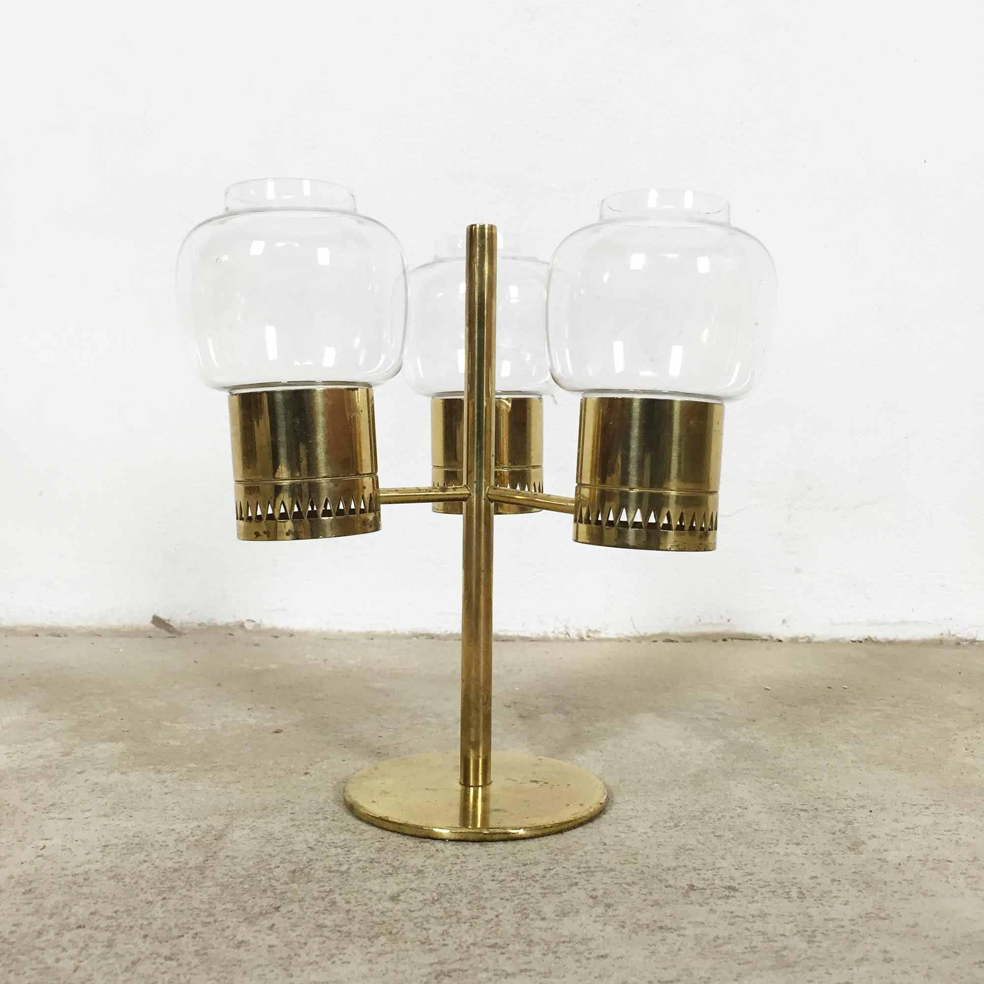 Brass candleholder.

Designed by Hans-Agne Jakobsson.

Produced by Hans-Agne Jakobsson A B, Markaryd, Sweden.

Original 1960s Hans-Agne Jakobsson candleholder produced in Sweden. Made of tubular brass with triangular patterned perforations and