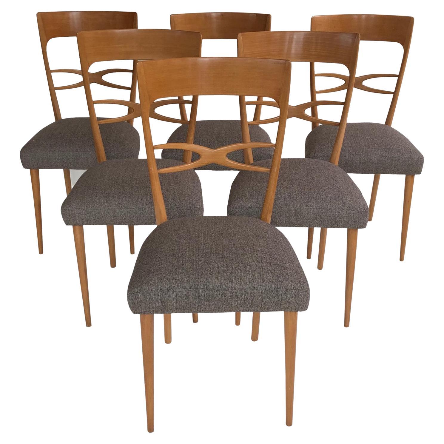 A set of six stylish and comfortable mid-century Italian dining room chairs, blond wood, grey upholstery, circa late 1940s - early 1950s. We often buy this model and could make up a larger set, please enquire.