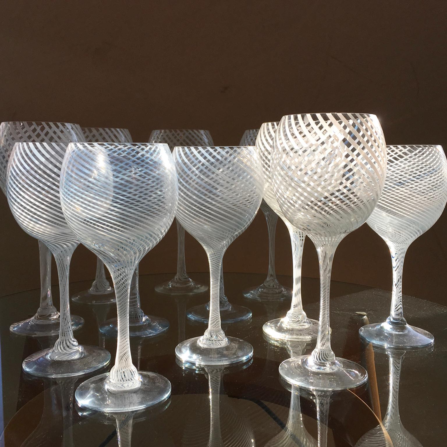 A rare set of 12 x (18 cm high) hand blown Murano wine glasses attributed to Venini.
Please note that the photographs show 2 sets.
 