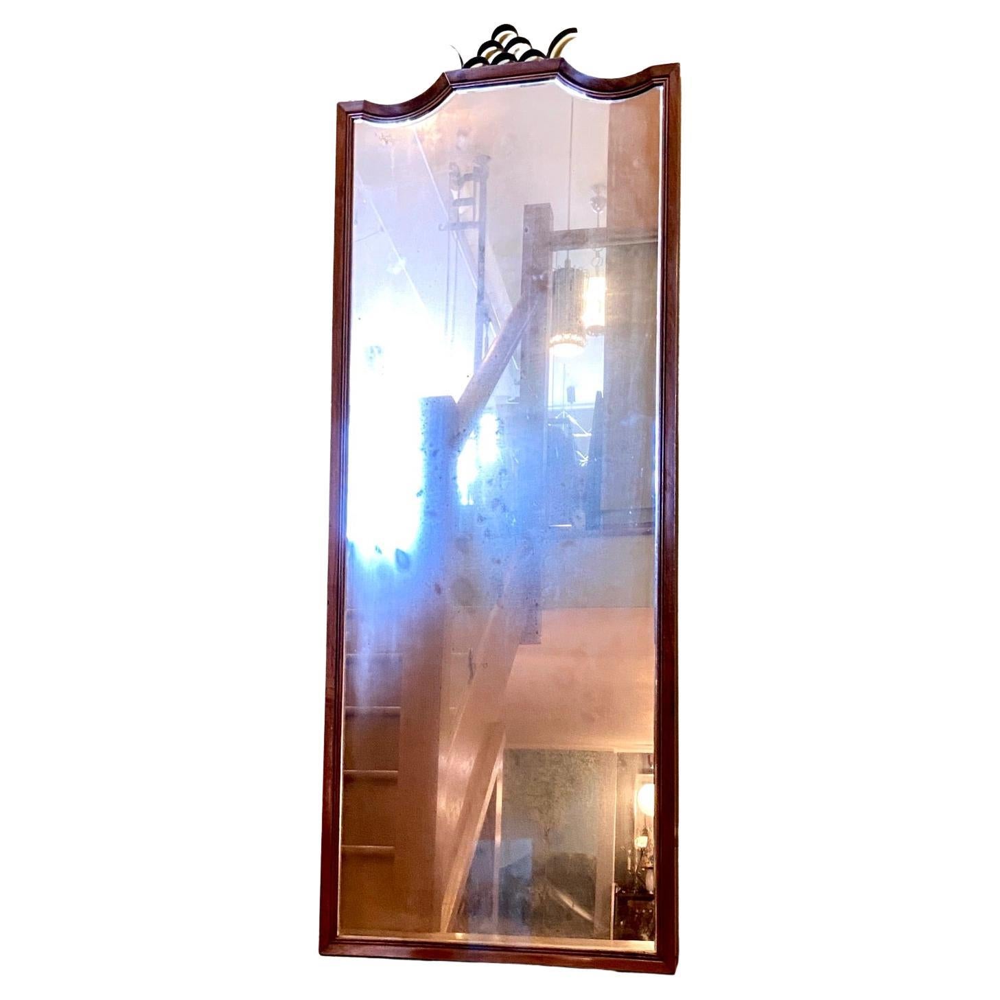 A Paolo Buffa good quality, heavy 1940s Art Deco Figured Walnut full length wall mirror with a thick black metal Crown decoration (possibly bronze). The mirrored surface is original from the 1940s and is faded and distressed. (see photos). The frame