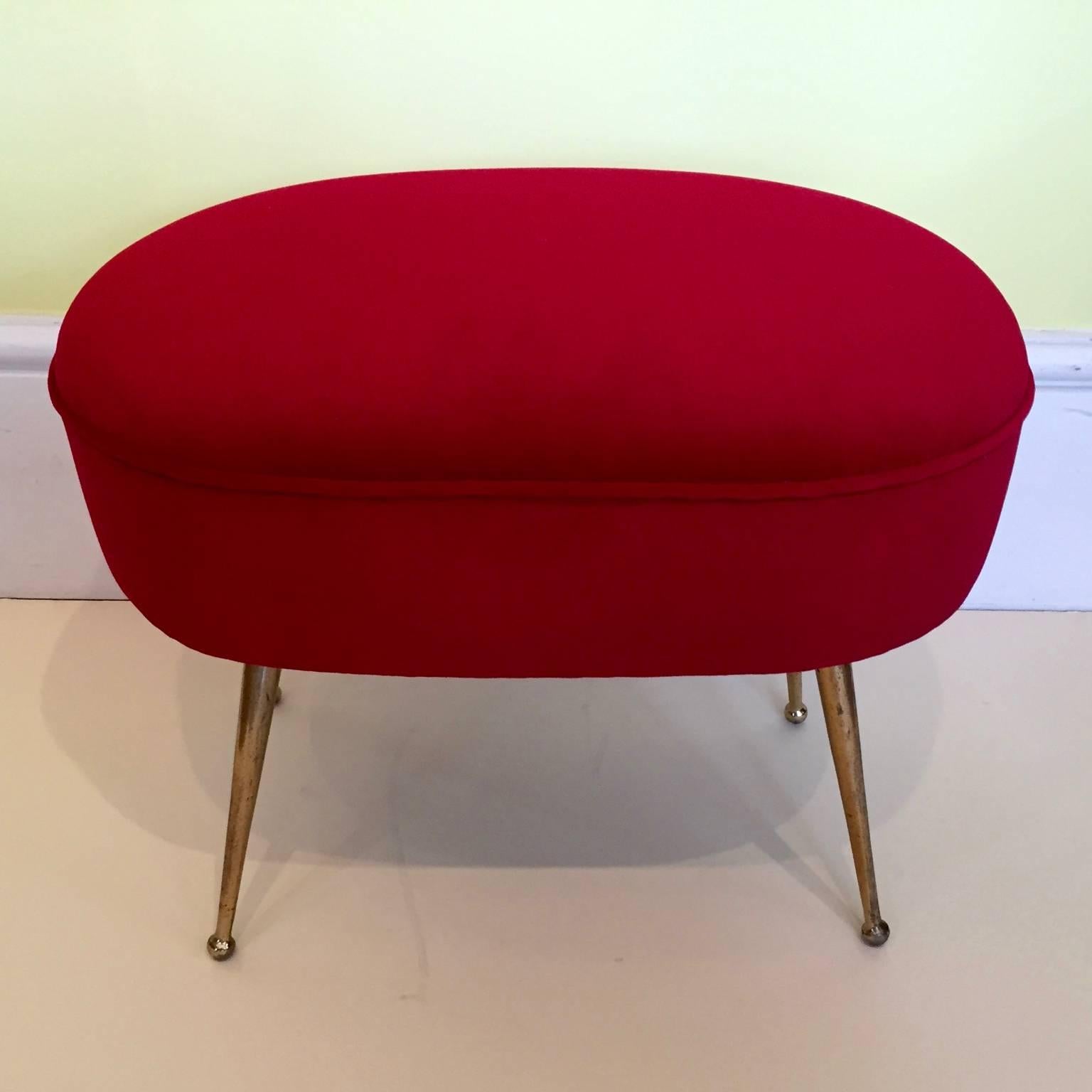 A pair of red Italian 1950s footstools, reupholstered.