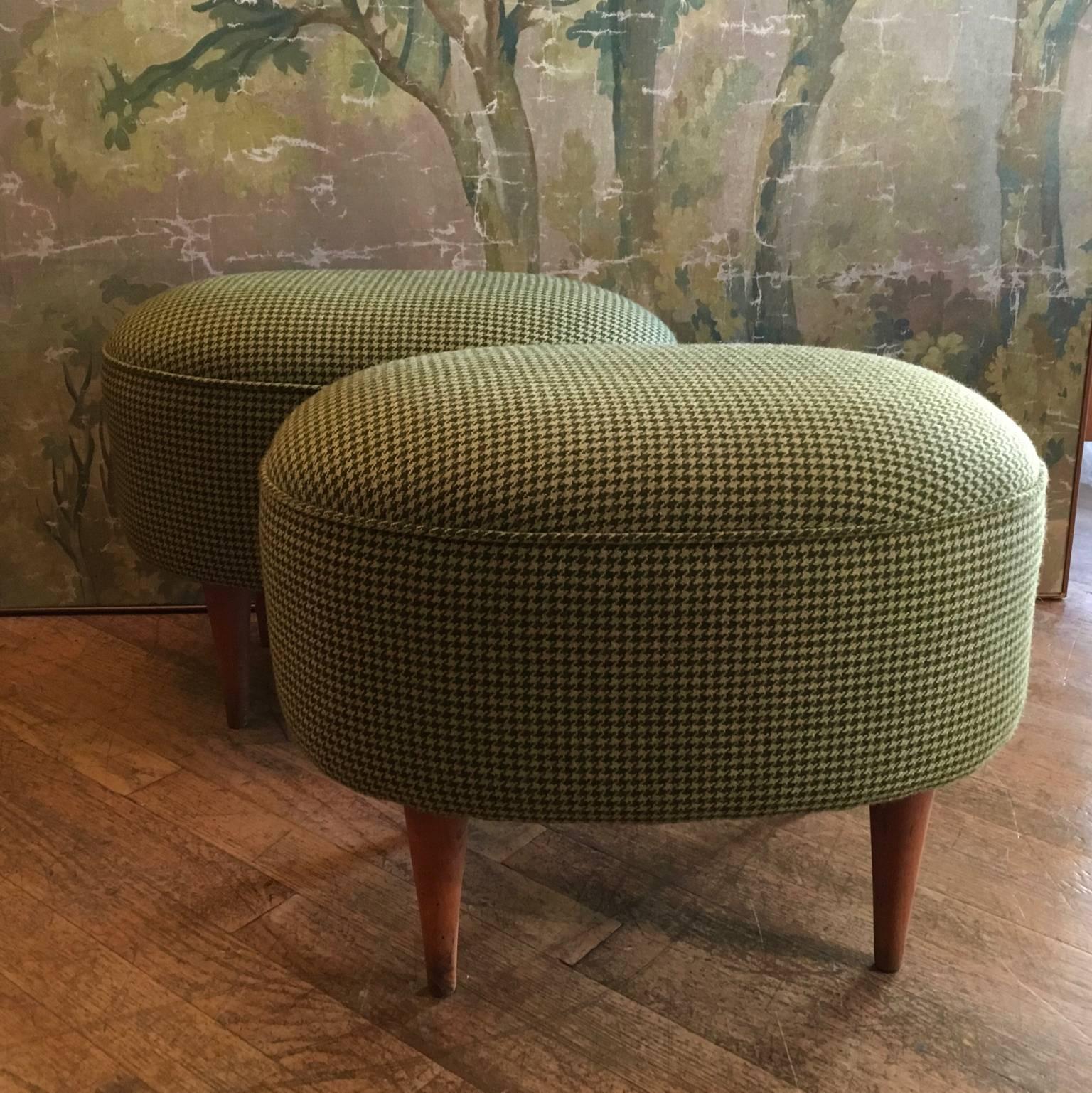 Two oval 1950s Italian stools reupholstered in a Scottish houndstooth (pied de poule) woolen fabric, wooden feet.
