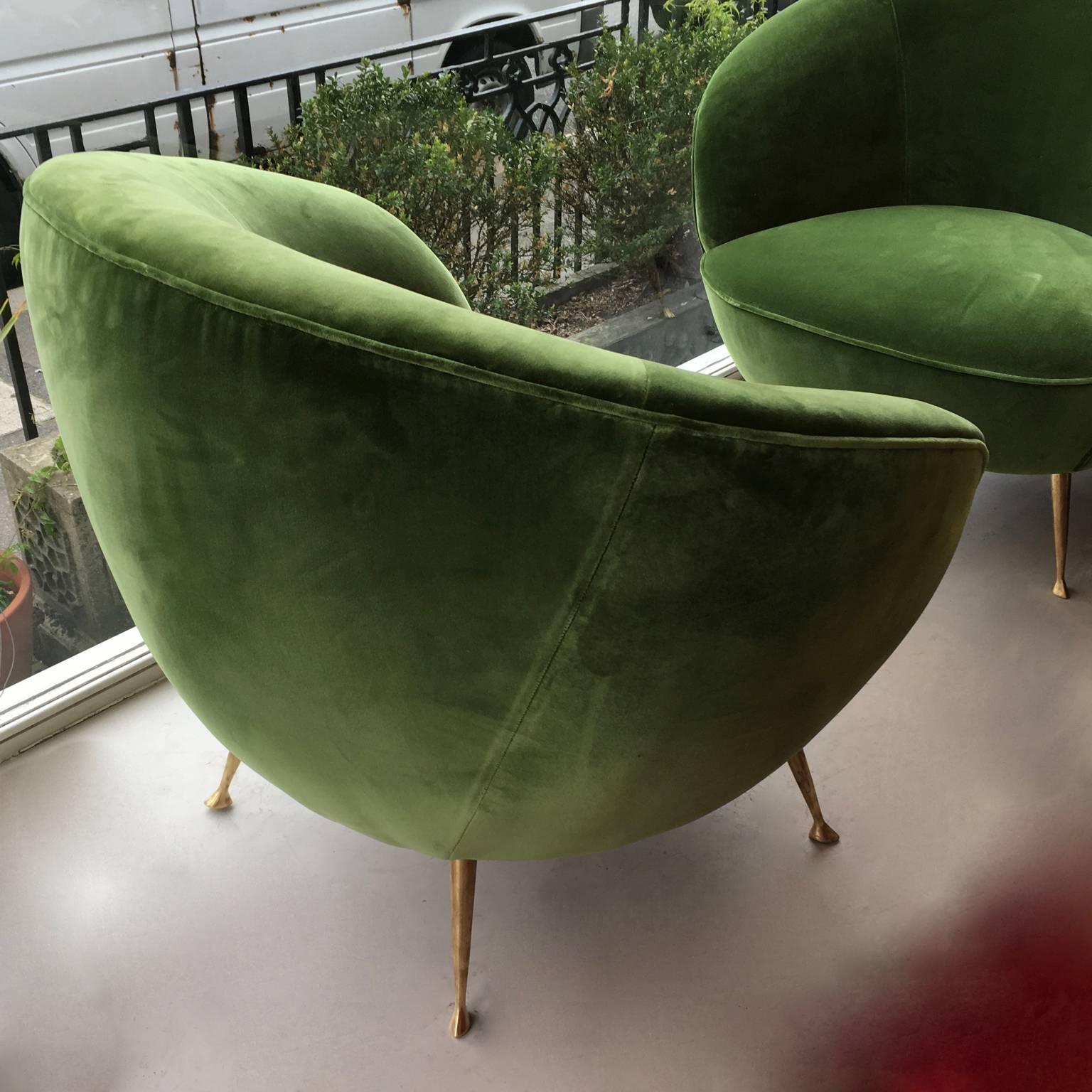 Two 1950s Italian semi-circular armchairs or tub chairs, reupholstered in green velours with original brass legs.
