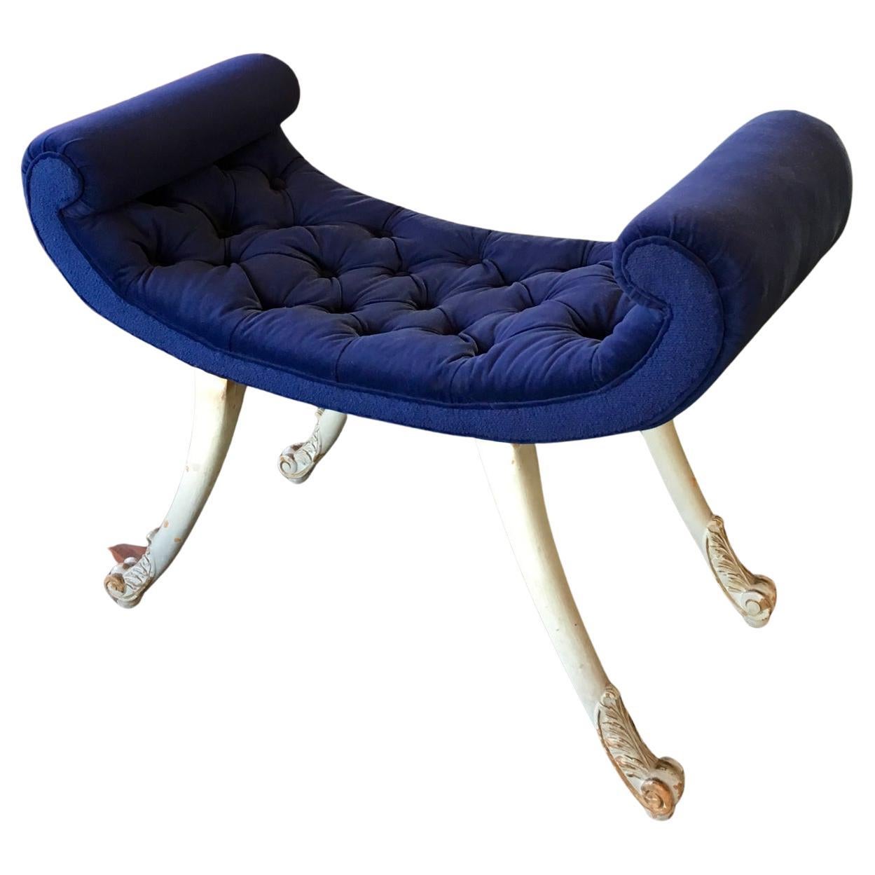 1920's to 1930's English, most probably by  H & L Epstein. 
Dramatic Art Deco stool (possibly dressing stool, piano stool or ottoman) with a navy blue capitonne velour upholstery. 
Originally Overpainted - really nice distressed look, light grey