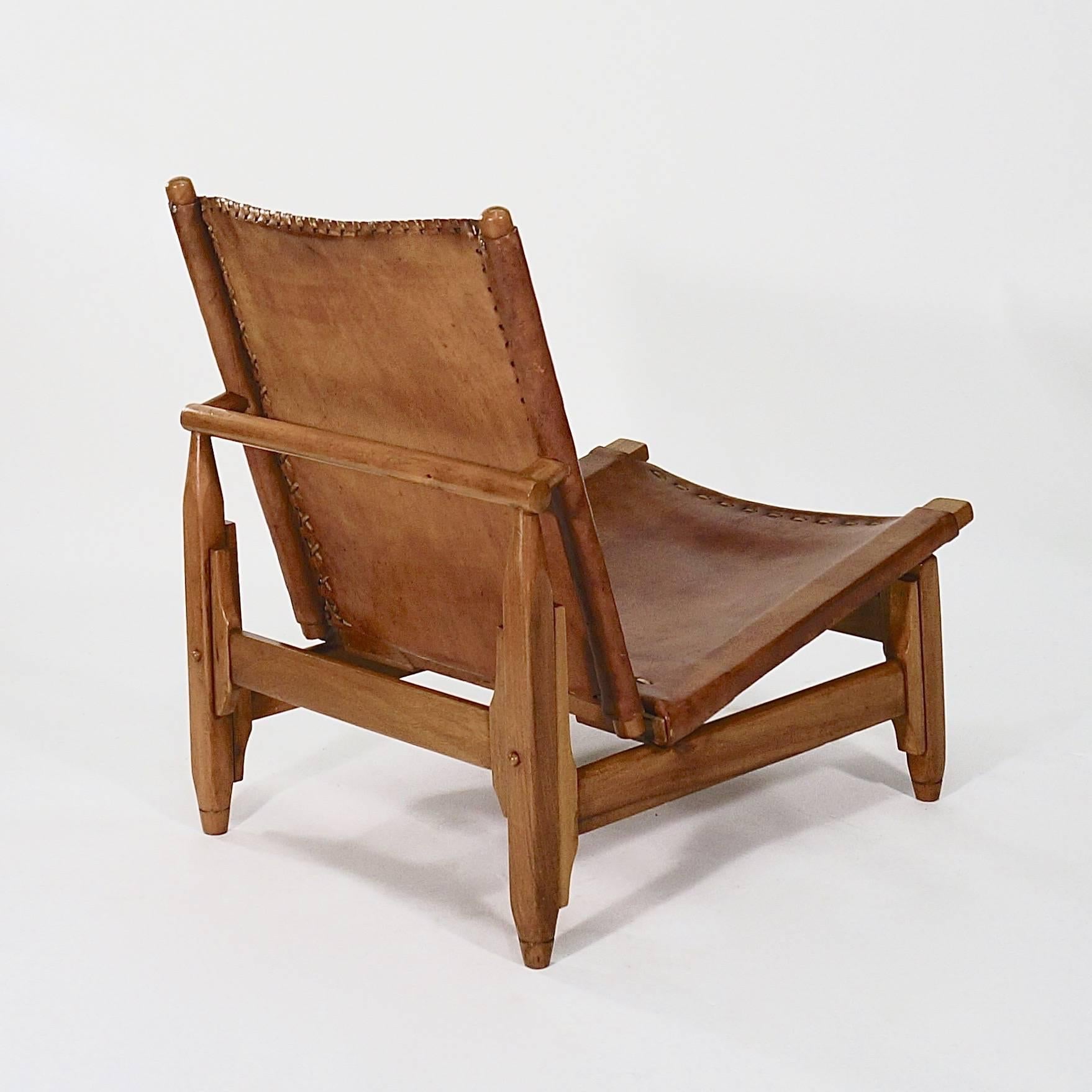 Polished Pair of Saddle-Stitched Leather and Walnut Low Chairs