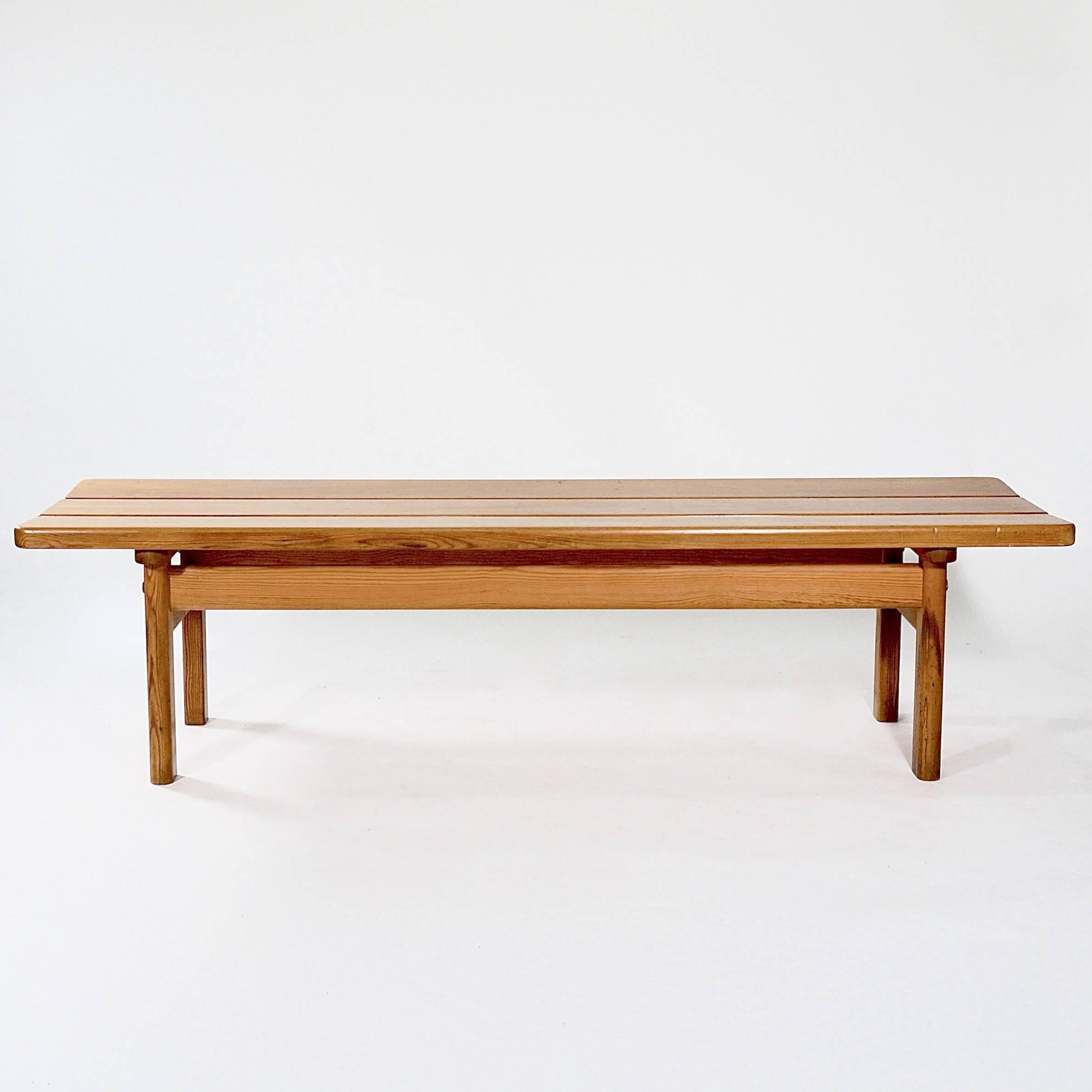 A pitch pine coffee table with a three plank top and simple legs and stretchers. Manufactured by Karl Andersson. Stamped Karl Andersson's.

Sweden, designed 1961.