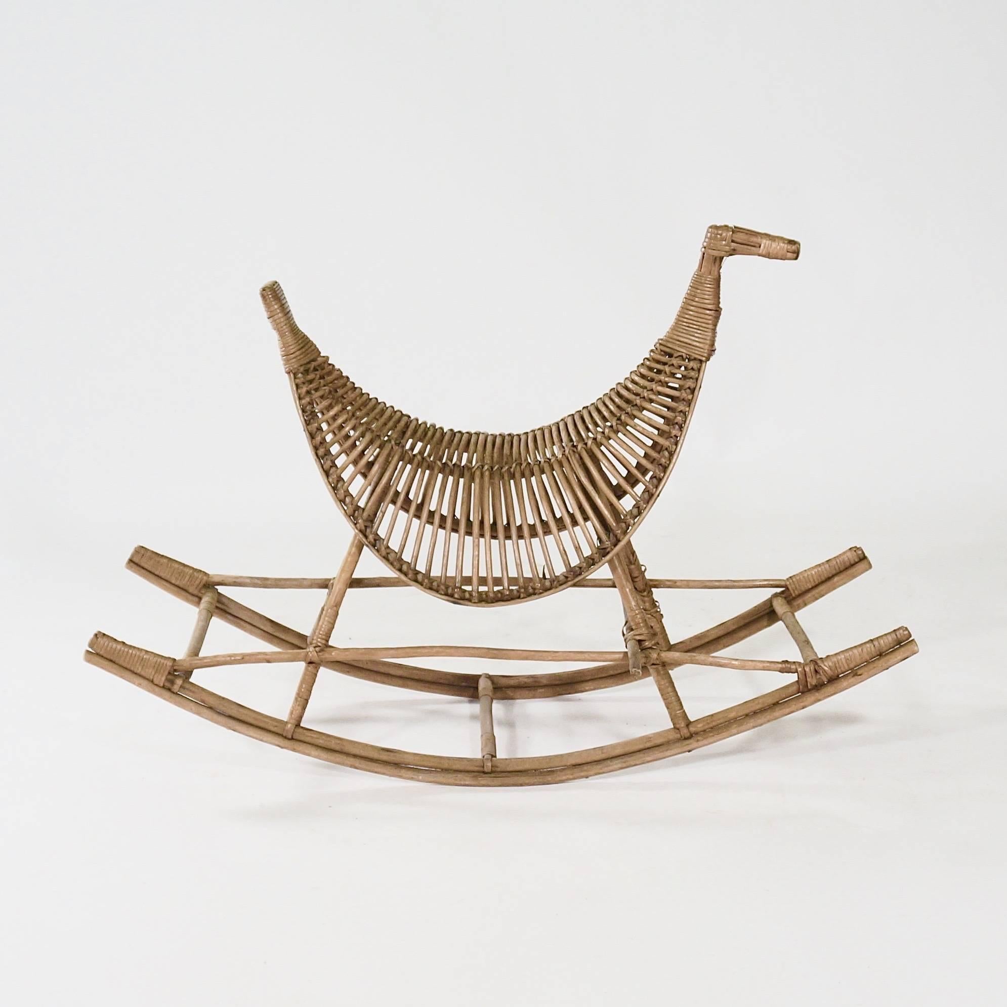 The bamboo body bound with rattan and supported by a rocking base,

Denmark, circa 1950s.