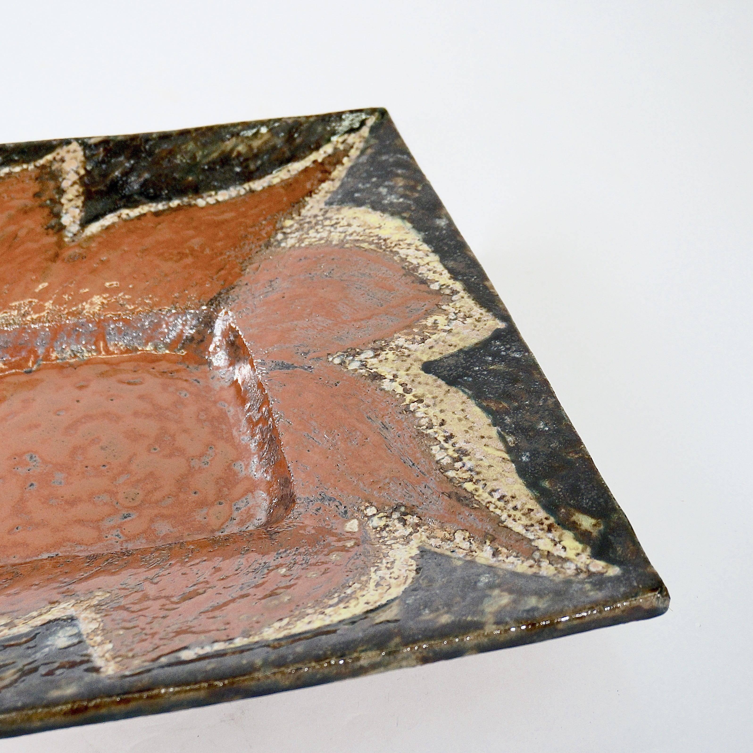 A large square stoneware charger with terracotta glazed centre and hand-applied mottling. 

Mary Lambert (1923-2013) was a friend and contemporary of Henry Moore.

England, circa 1960s

Provenance: The studio of Mary Lambert.