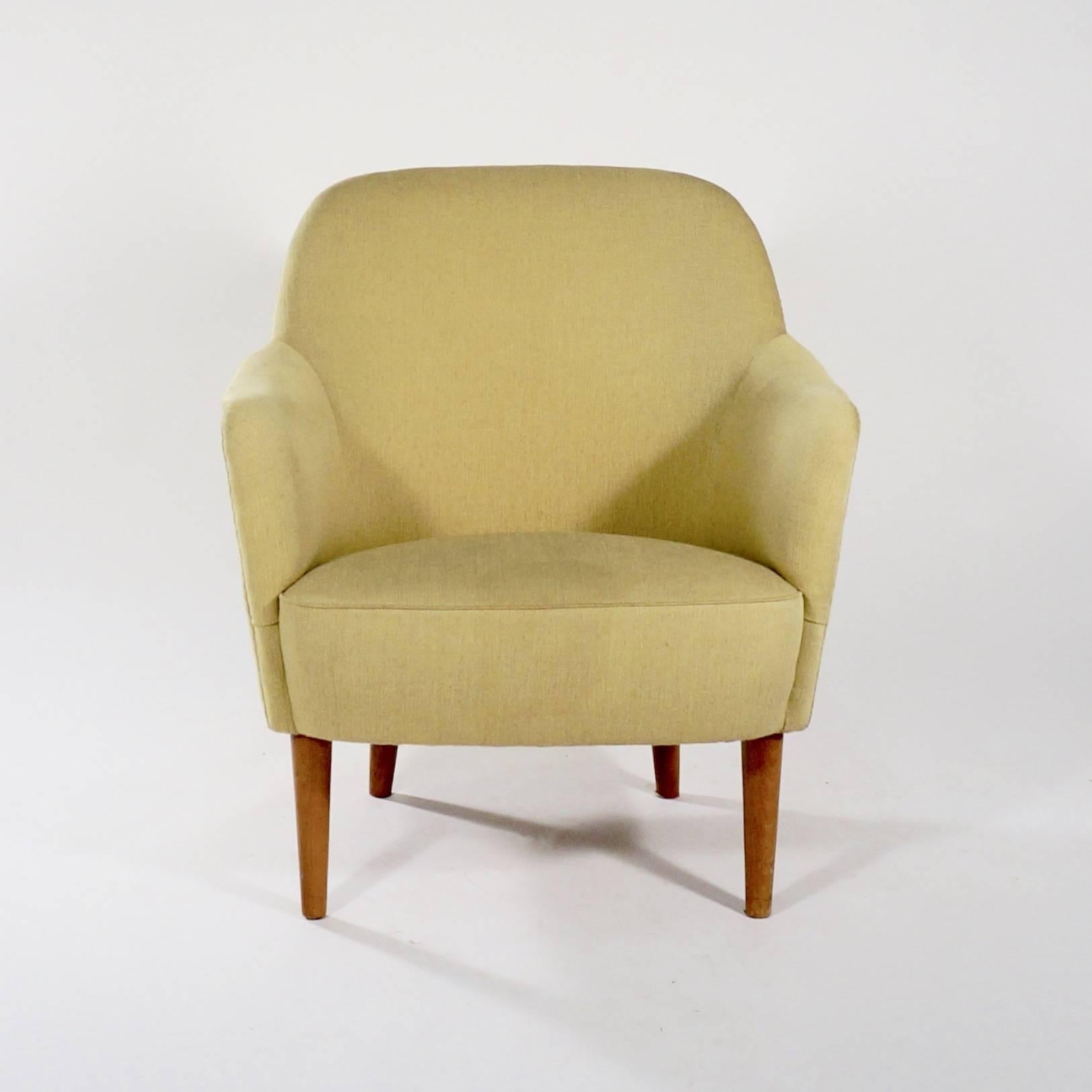 An upholstered 'Sampsel' chair with stained beech legs, a curved back and roll-over arms,

Sweden, circa 1950s.

One of Sweden's leading 20th century furniture designers, Malmsten's chairs demonstrate Scandinavian design at its best.