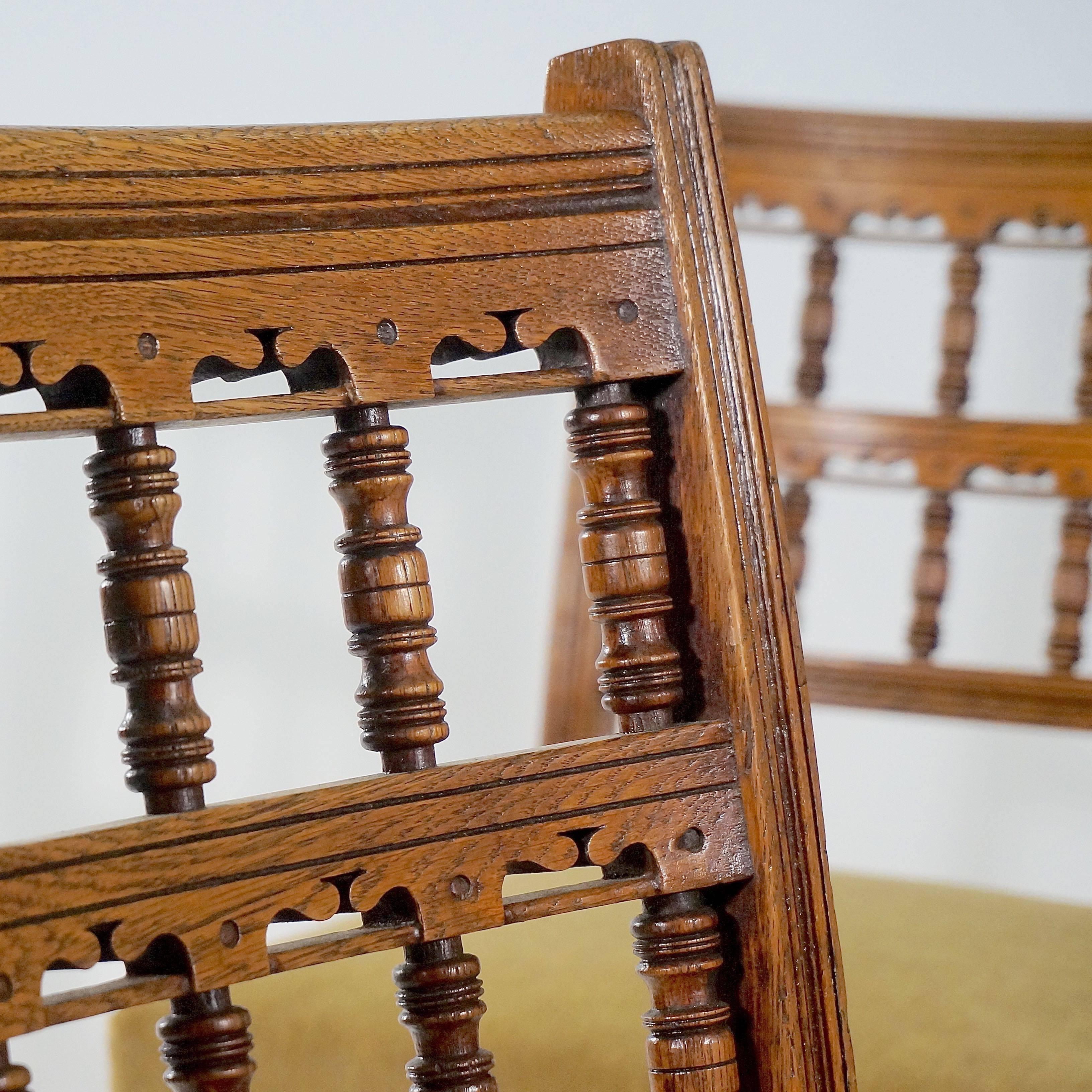 Polished Set of Four Carved Oak Side Chairs by Bruce Talbert