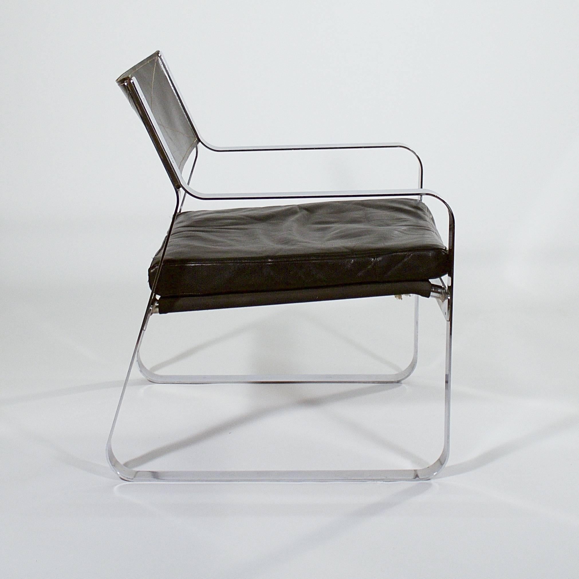 A rare polished steel armchair with a riveted frame and stitched black leather back and seat cushion attributed to Karl Erik Ekselius (1914-1998).

Denmark, circa 1960s.