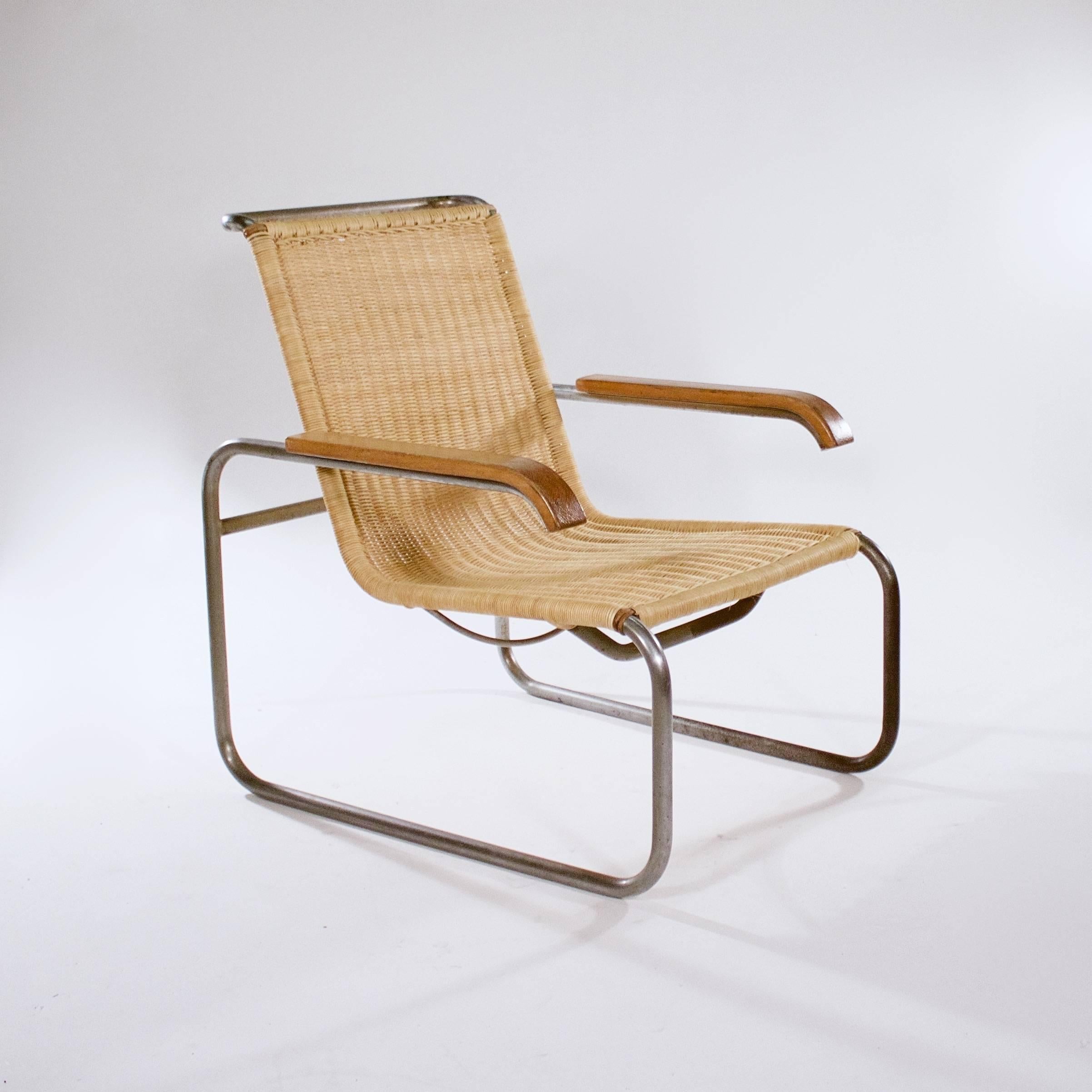 A 'B35' tubular metal and wicker armchair. Designed in 1928 and manufactured by Thonet. 

This model, circa 1940s.