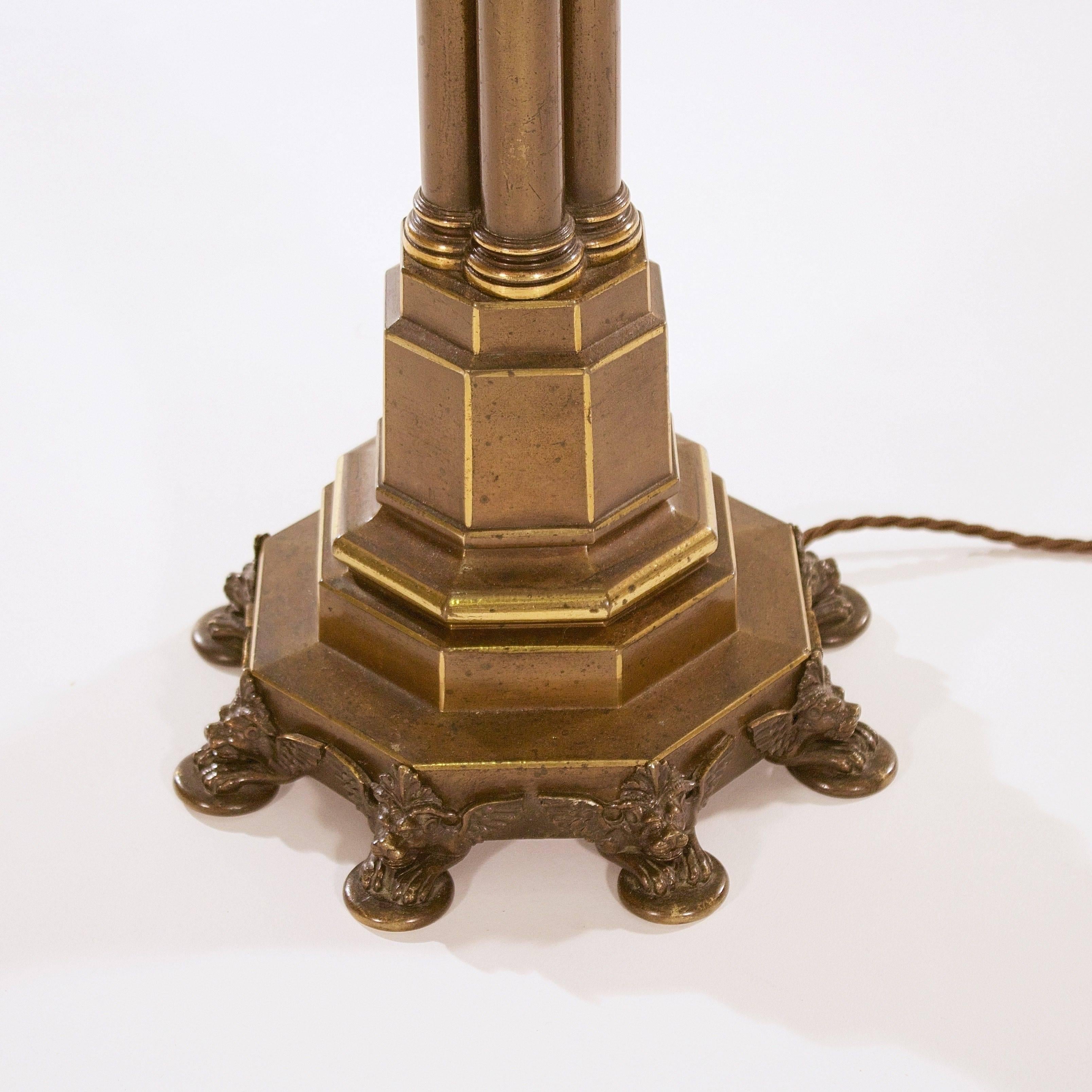 With a scolling leaf capital supported by a cluster column stem on an octagonal stepped plinth base with chimera feet,

England, circa 1825.

Measurement taken to the top of the capital.