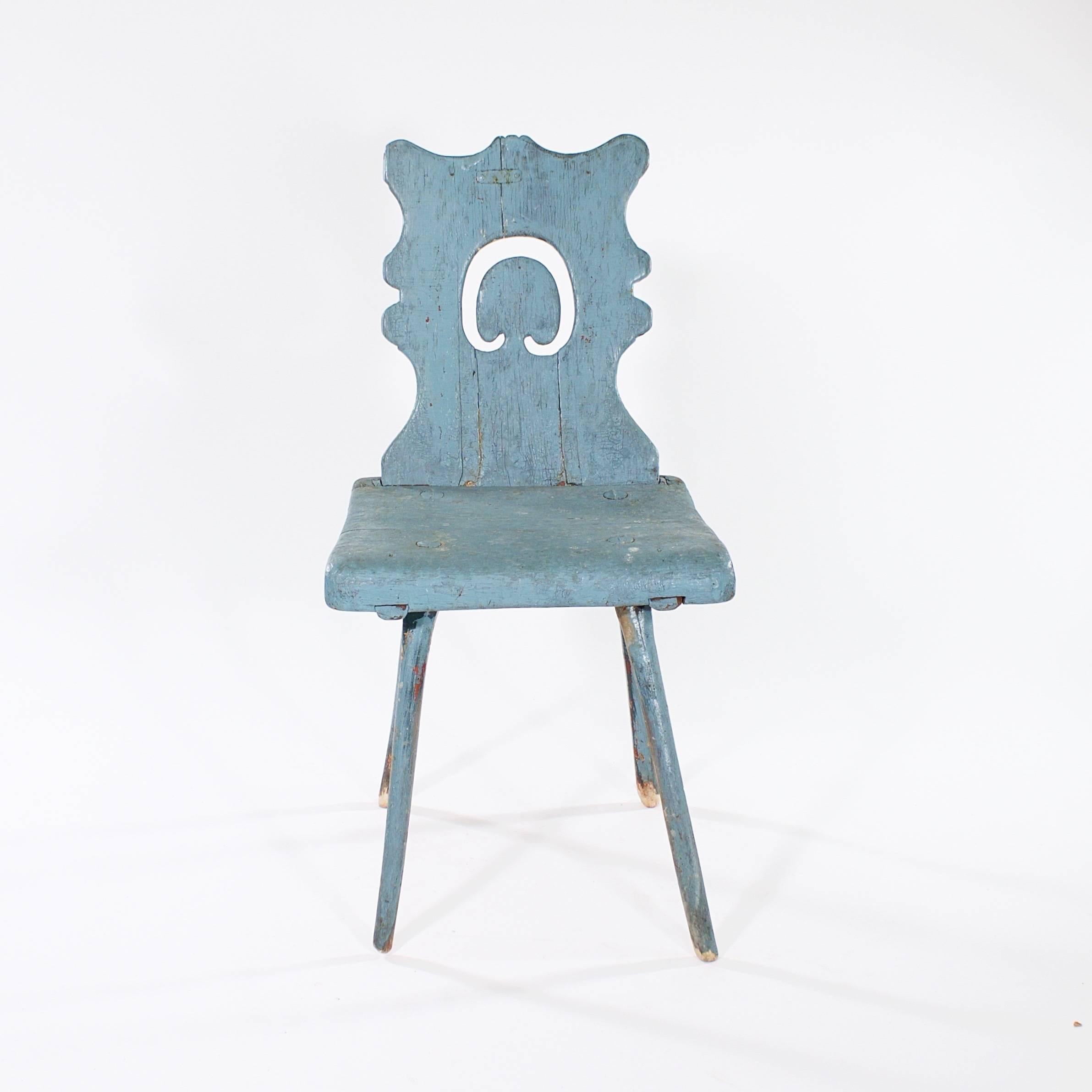 The shaped pierced back supported by a simple seat on four twig legs. With later but old blue paint.

Sweden, circa 1880s

