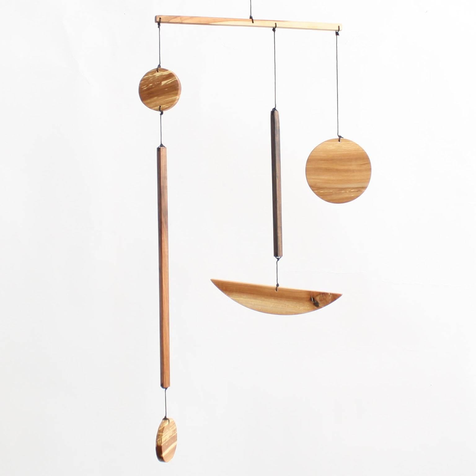 Fort Makers apple medium B Mobile is made in Brooklyn by Noah Spencer. His wooden Kinetic sculptures explore organic and linear form and touch upon a human fascination with the universe.

Materials: Apple wood, wax string with end loop for hanging.