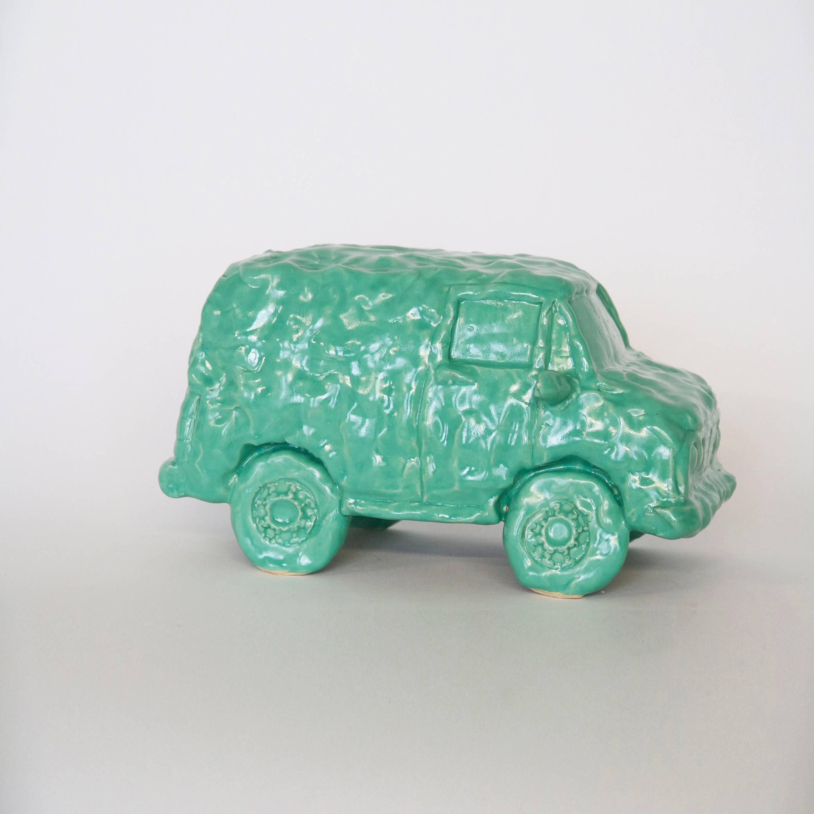 Keith Simpson has made these types of ceramic vehicles intermittently over the past years. He likes to make the underdog car models. Keith says, 
