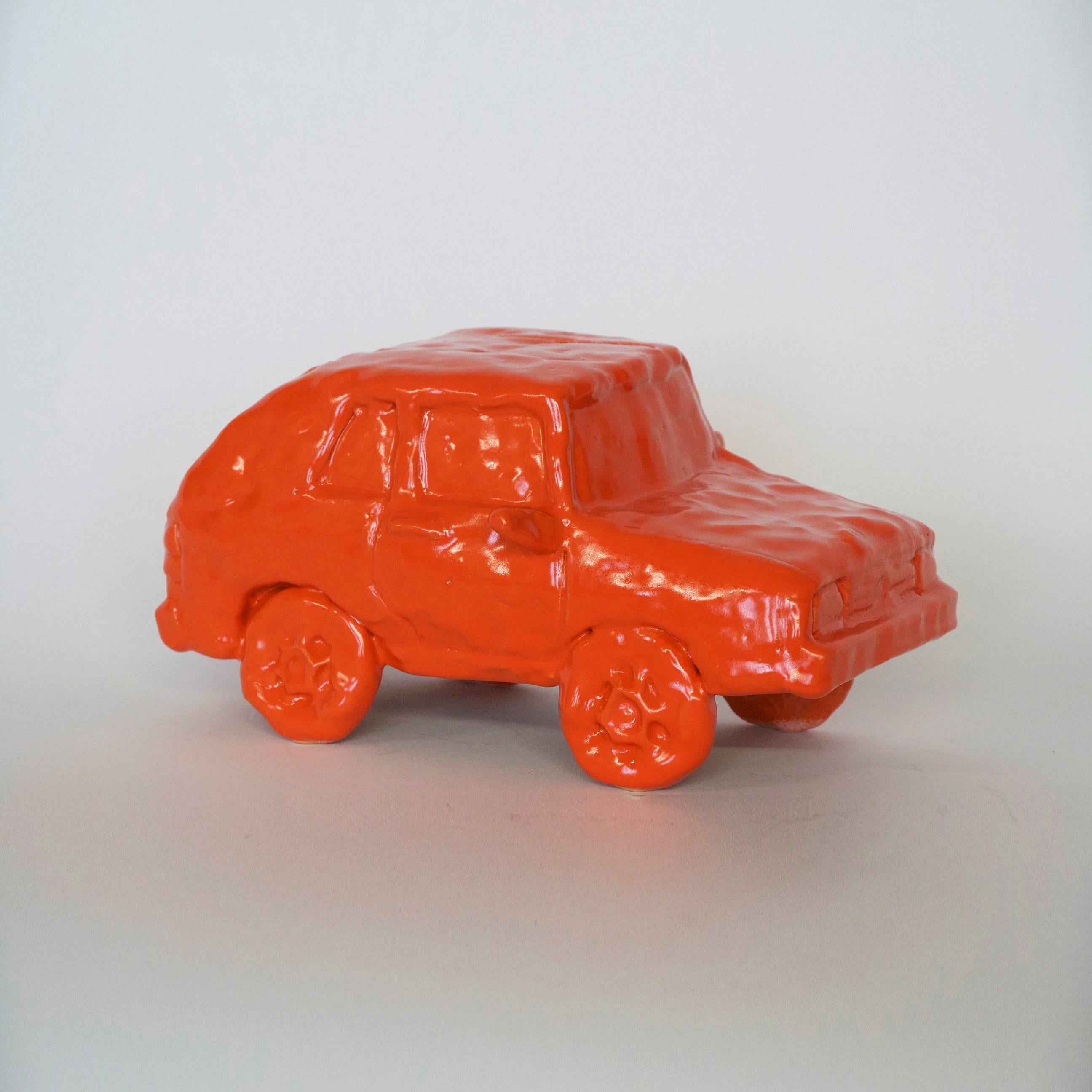 Keith Simpson has made these types of ceramic vehicles intermittently over the past years. He likes to make the underdog car models. Keith says, "They are like the cars that you might inherit from your grandparents if you had your sweet 16 in a