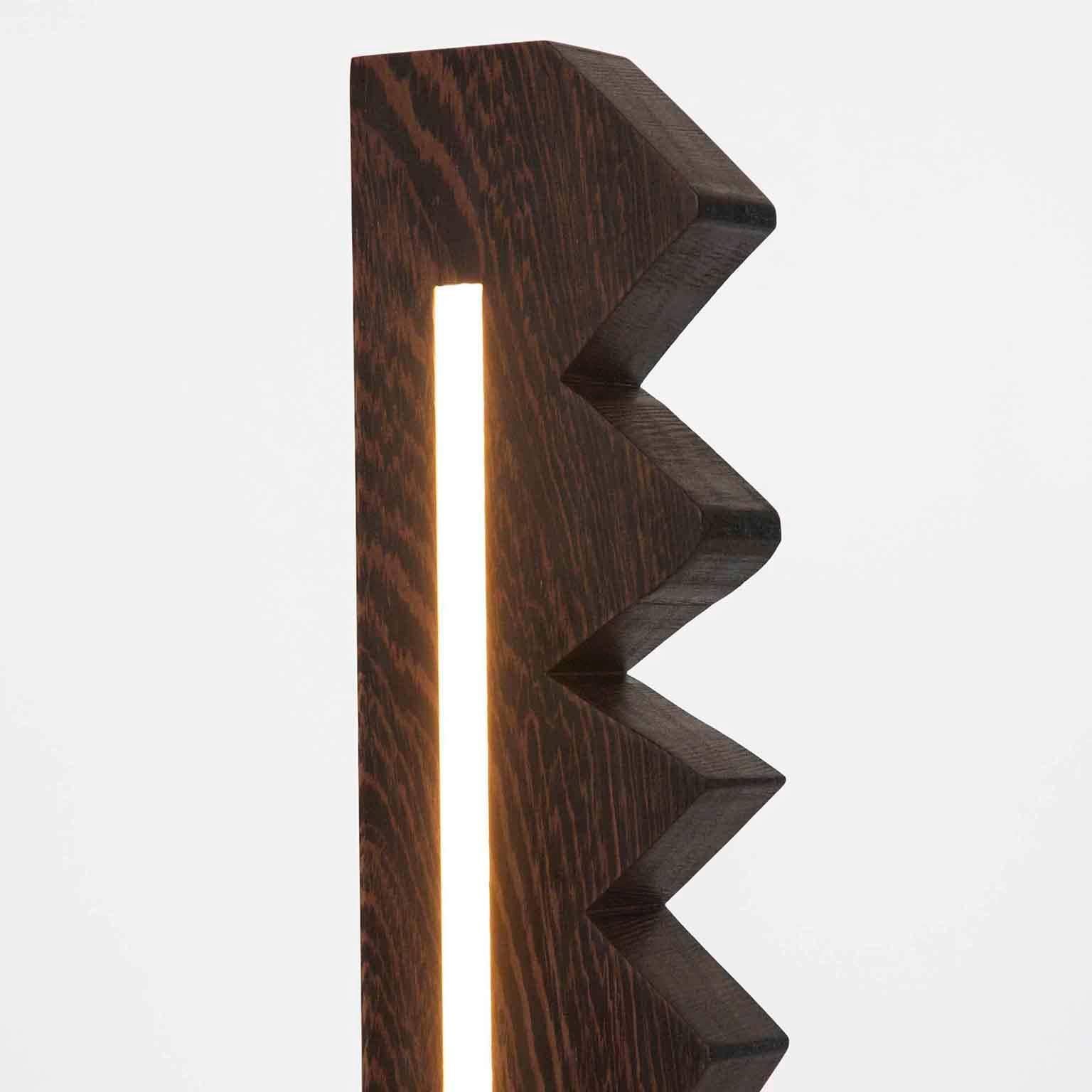 Fort Makers' Chunky Zag Wenge Line Light is made in Brooklyn by Noah Spencer. This sculptural LED light juxtaposes hard lines with soft reflected light and emits an ambient aura. The lifespan of an LED strip is approximately 50,000 hours.
12 Volts