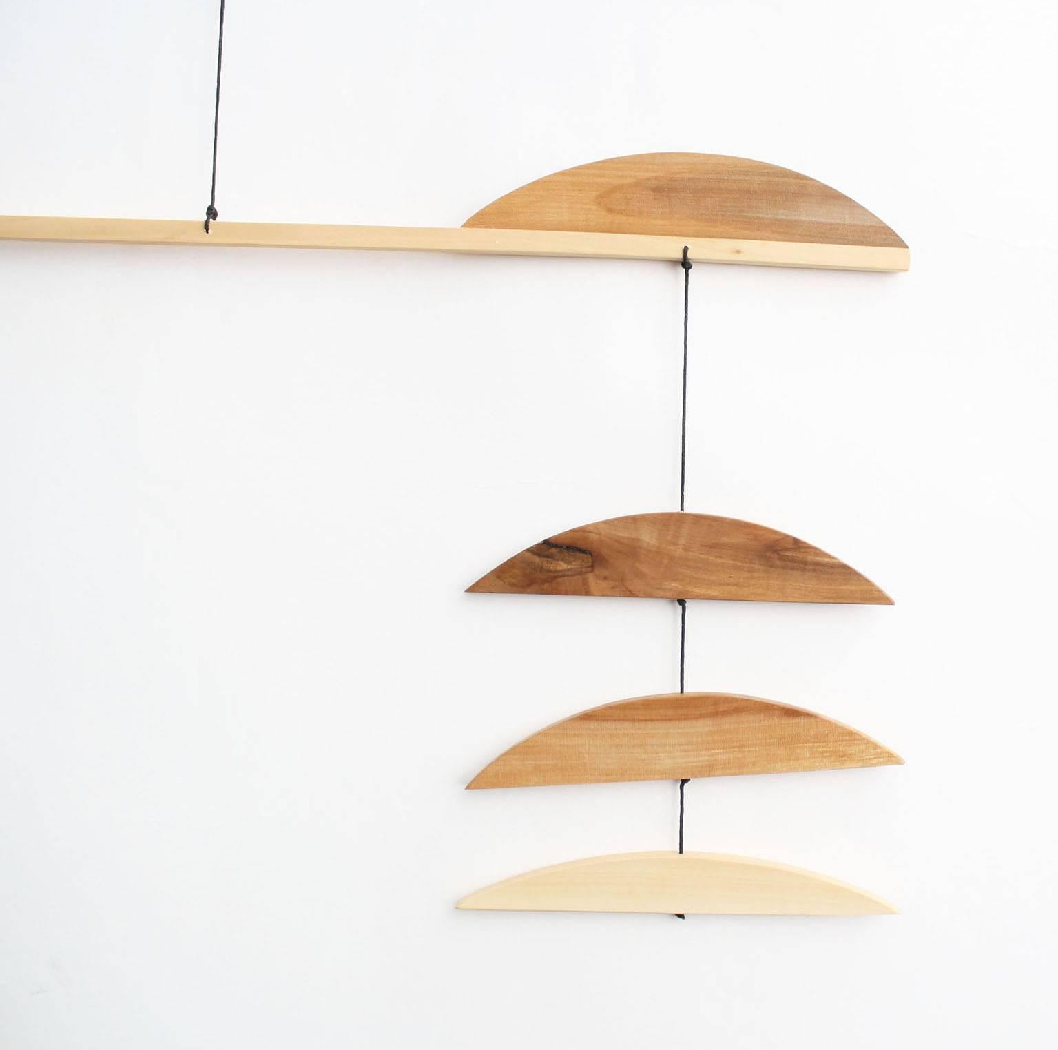 Fort Makers' Large Apple B Mobile is made in Brooklyn by Noah Spencer. His wooden kinetic sculptures explore organic and linear form and touch upon a human fascination with the universe.

Materials: apple wood, wax string with end loop for hanging