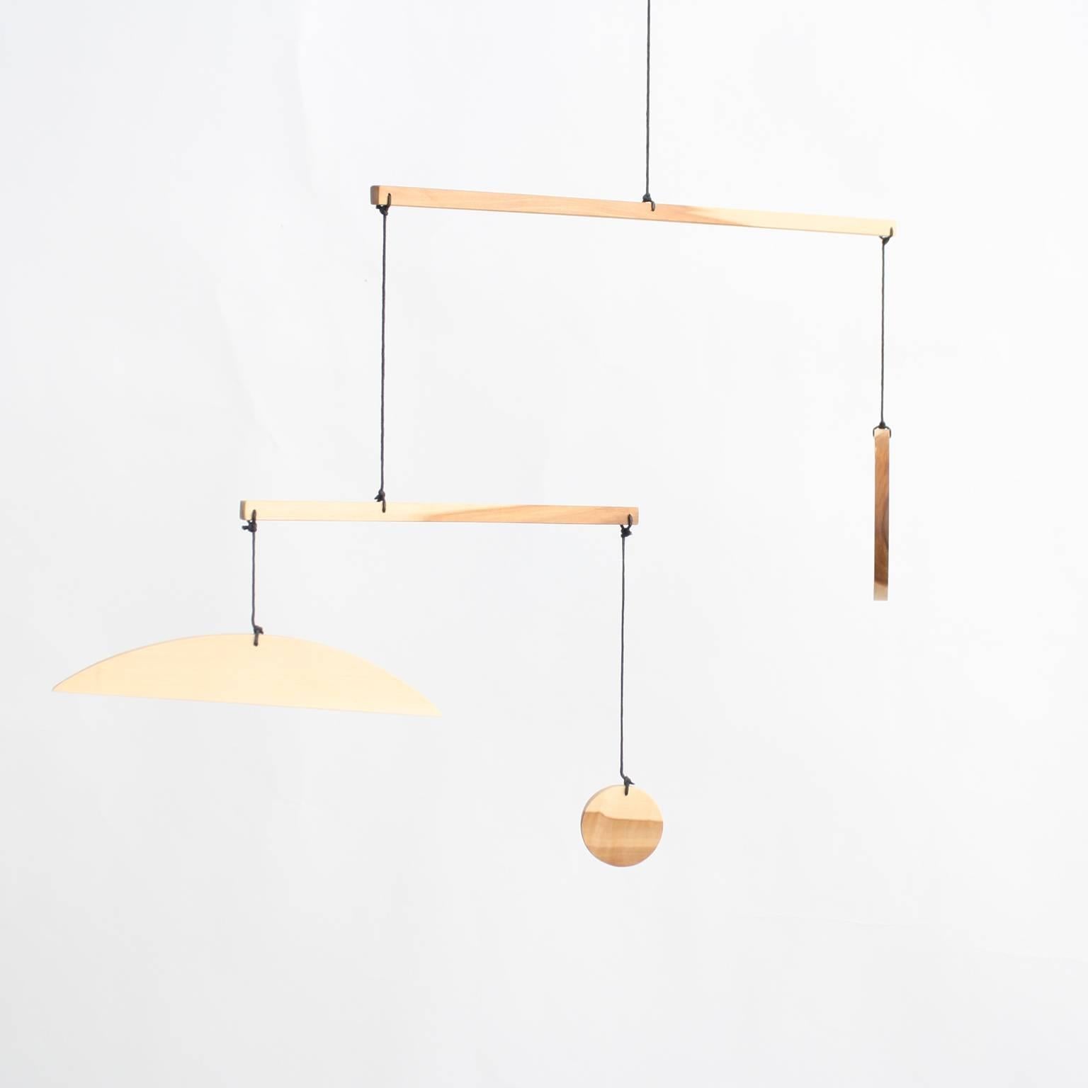 Fort Makers Small Apple Mobile is made in Brooklyn by Noah Spencer. His wooden Kinetic sculptures explore organic and linear form and touch upon a human fascination with the universe.

Materials: Apple wood, wax string with end loop for hanging.