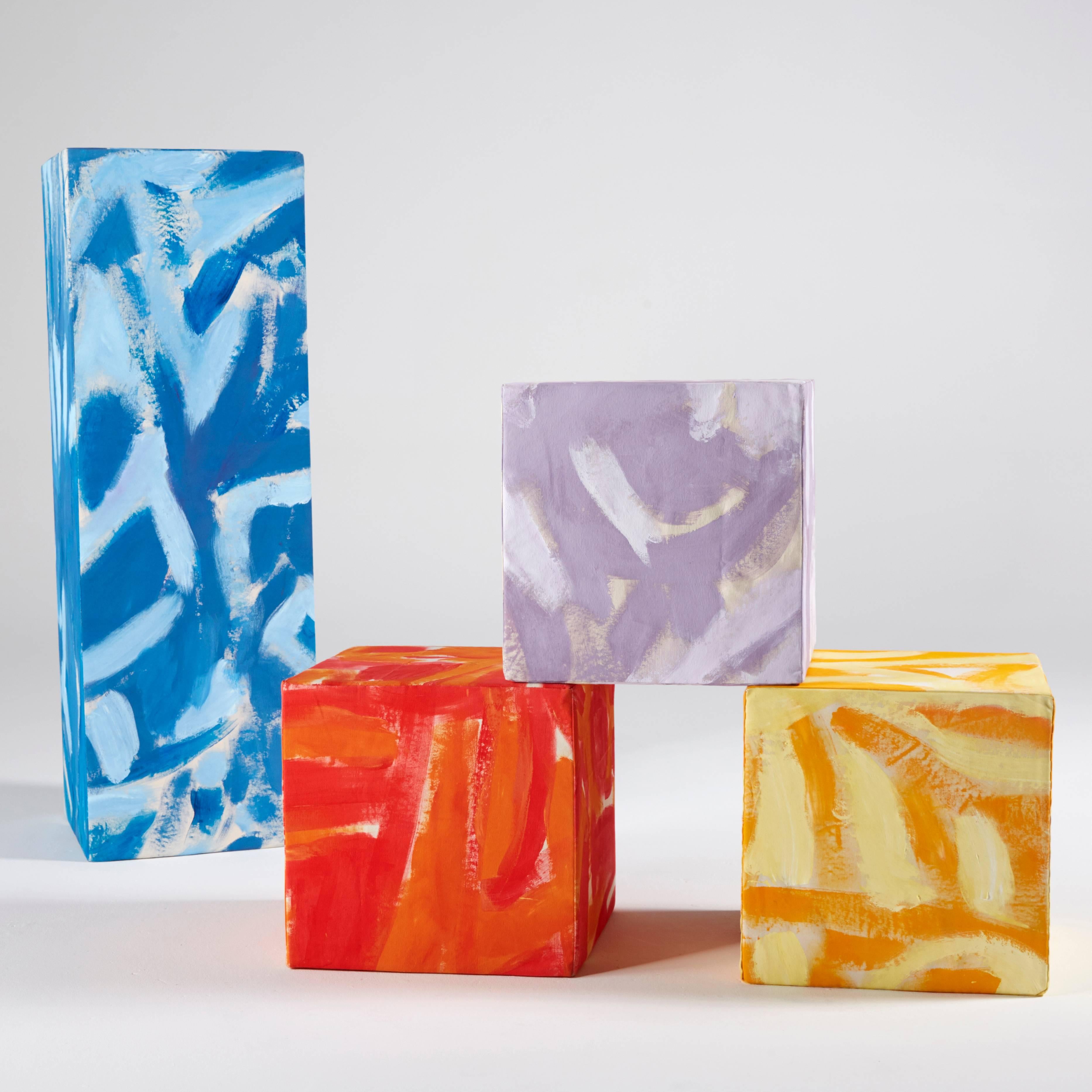 Cubicles by Naomi Clark is a set of three hand-painted stuffed squares and one stuffed rectangle that together make multiple sculptural configurations and seating arrangements. This set of soft sculptures, painted in Naomi’s signature Two-Hue style,
