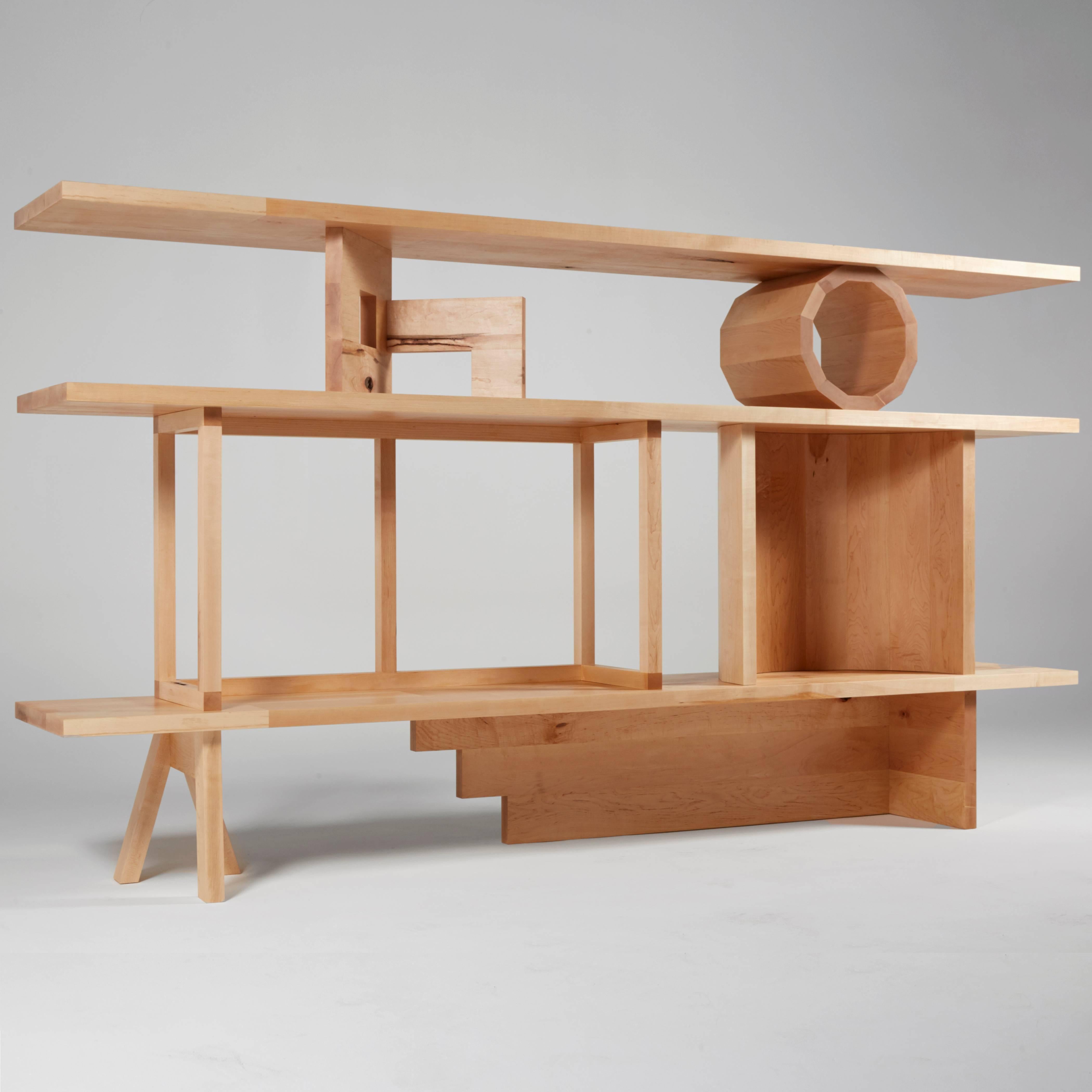 Stack Shelving Unit is a grouping of architectural and abstract sculptures by Noah Spencer that together make a shelving unit. When these sculptures are moved around and used in different positions to hold up shelving planks, they create multiple