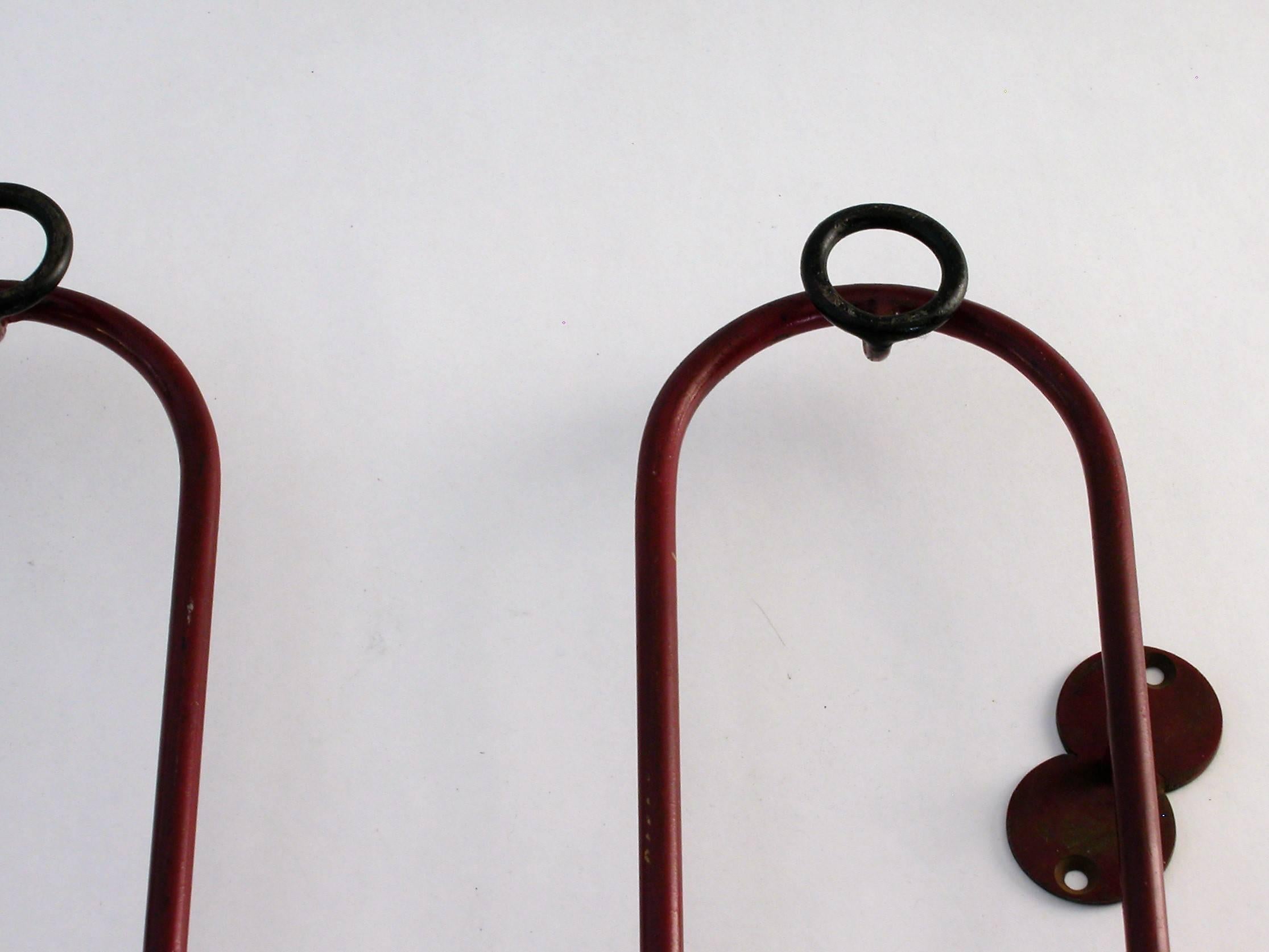 Coat rack attributed to Jean Royère (France 1921-1981), circa 1950.
Painted red and black wrought iron.
 
A variant of this model has been sold at Christie's New York on June 10, 2015 and another variant, a corner coat rack,
at Sotheby's New