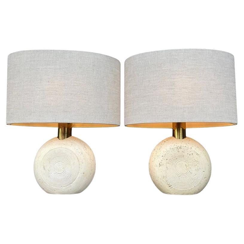 A pair of circular Italian 1970s travertine and brass lamps by Fratelli Manelli For Sale
