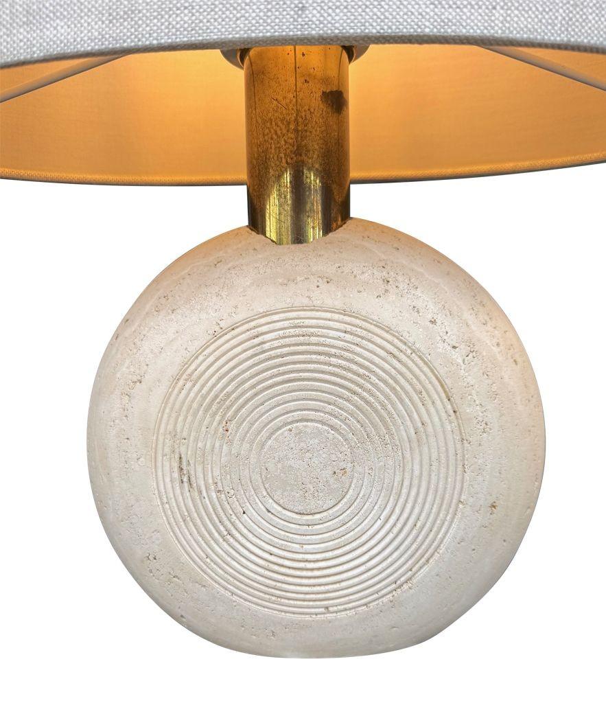 A pair of circular Italian 1970s travertine and brass lamps by Fratelli Manelli. Re wired with new brass fittings, antique gold cord flex and PAT tested 