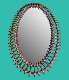 An Italian 1970s oval split cane bamboo mirror by Franco Albini for Bonacina