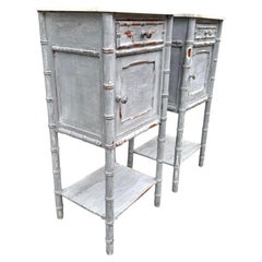 A pair of French 1930s faux bamboo painted wood and marble bedside tables